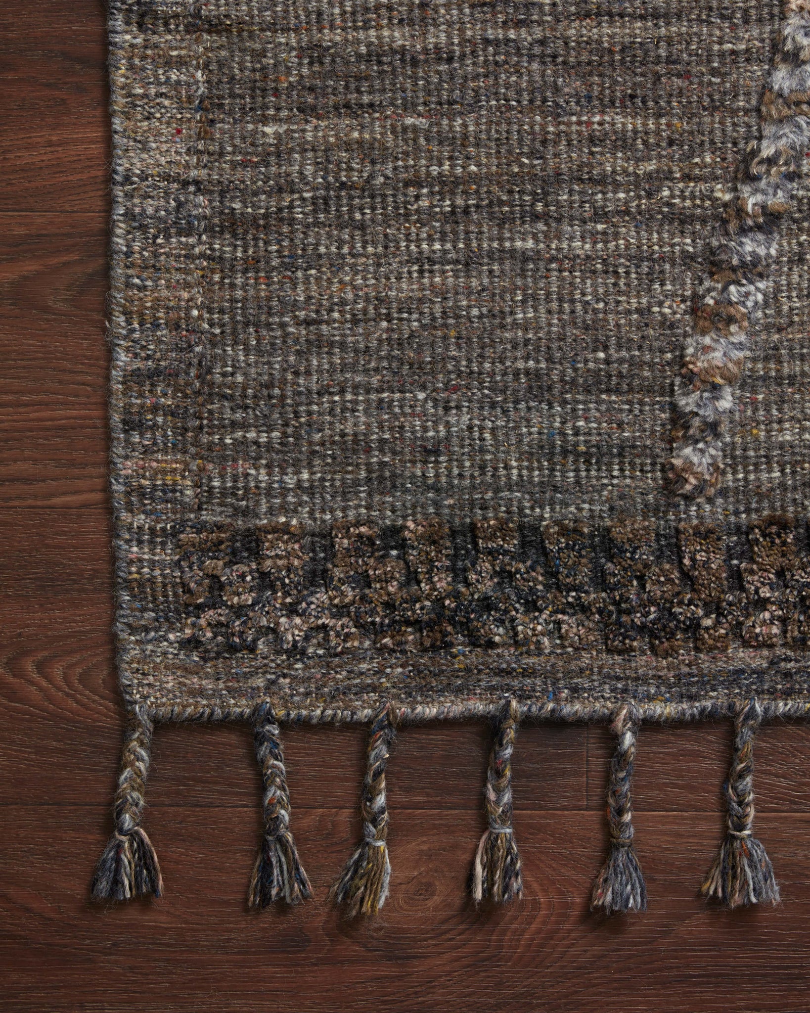 Side view of the Iman Grey / Multi rug.