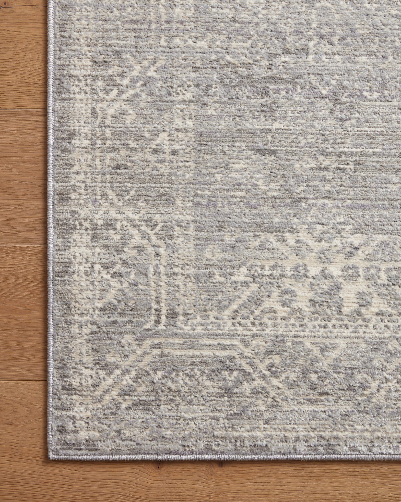 Side view of the Indra Silver / Ivory rug.