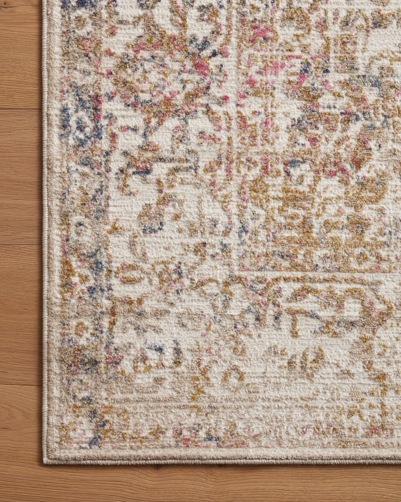 Side view of the Indra Ivory / Multi rug.