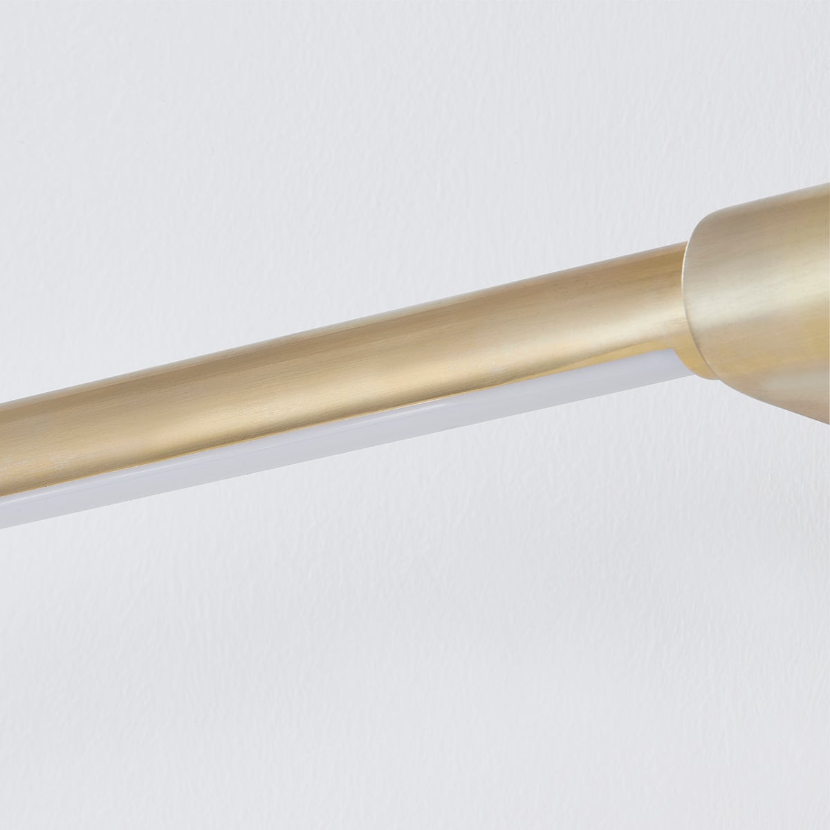 Close-up of the Jerome Picture Light 30" in aged brass showing the arm curve and shade proportion.
