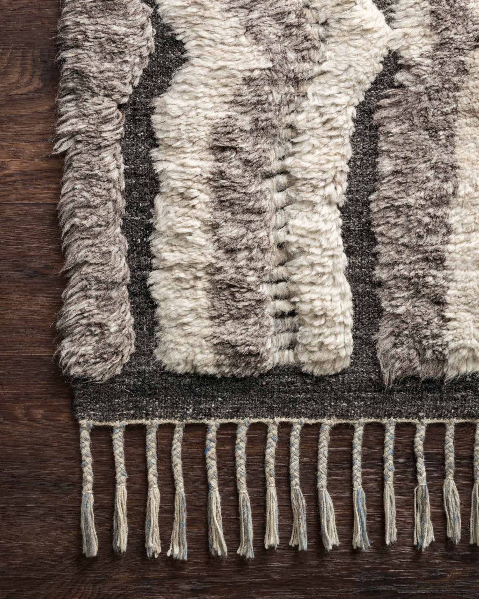 Side view of the Khalid Stone / Charcoal rug.
