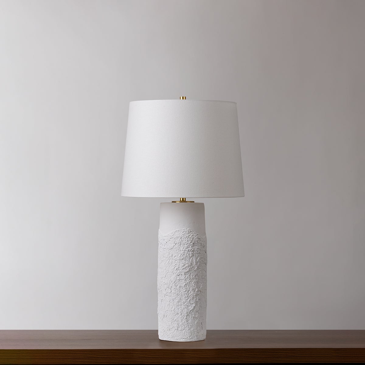Tolland Table Lamp in aged brass shown from a second angle to highlight the base and shade proportions.
