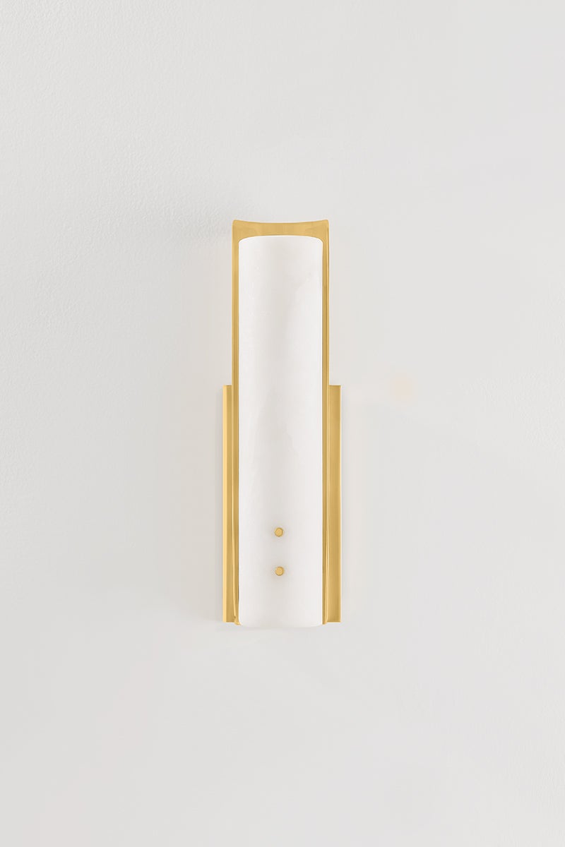 Lucio Wall Sconce 4.25" x 14.5" in aged brass shown from a second angle to highlight the arm curve and shade silhouette.