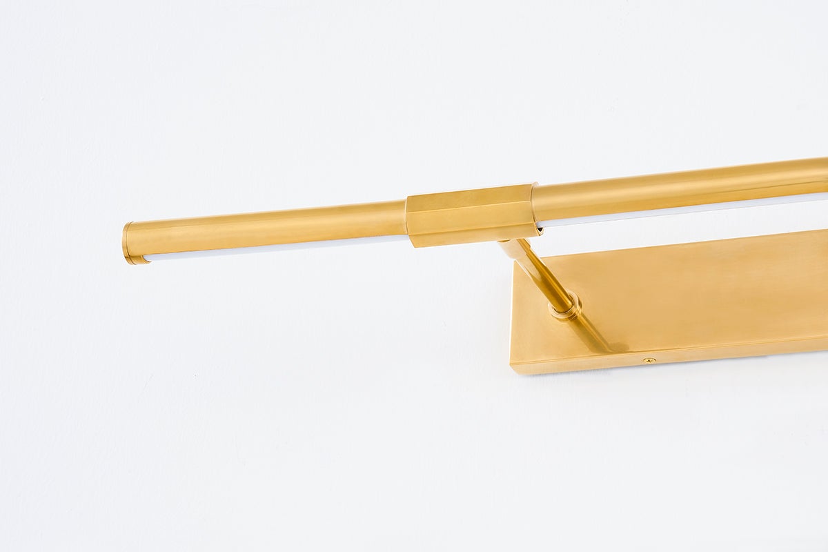 Close-up of the Melbourne Picture Light 30" in aged brass showing the arm curve and shade proportion.