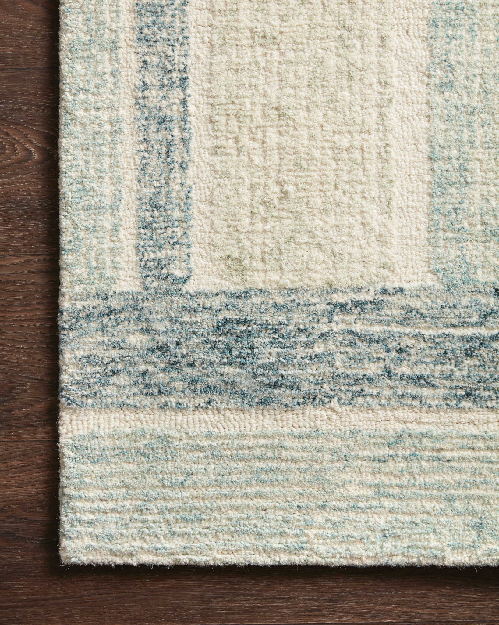 Side view of the Milo Aqua / Denim rug.