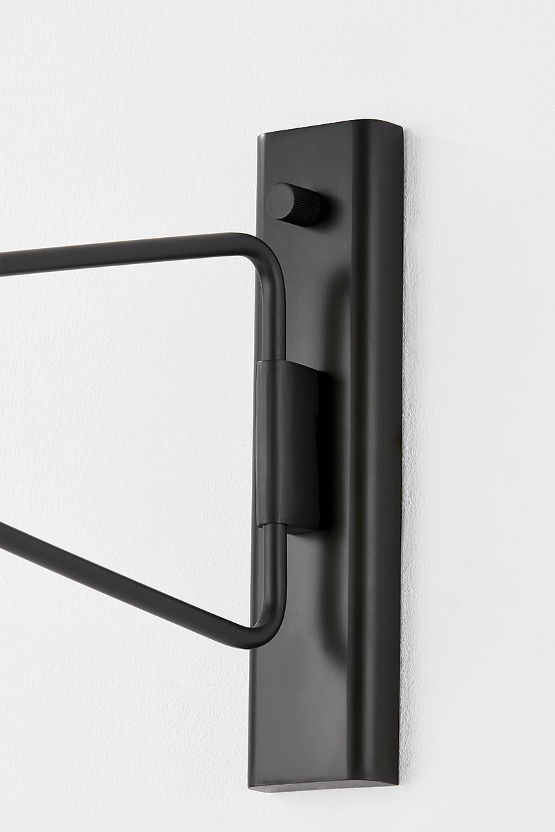 Close-up of the Northford Wall Sconce in dark bronze showing the arm curve and shade silhouette.