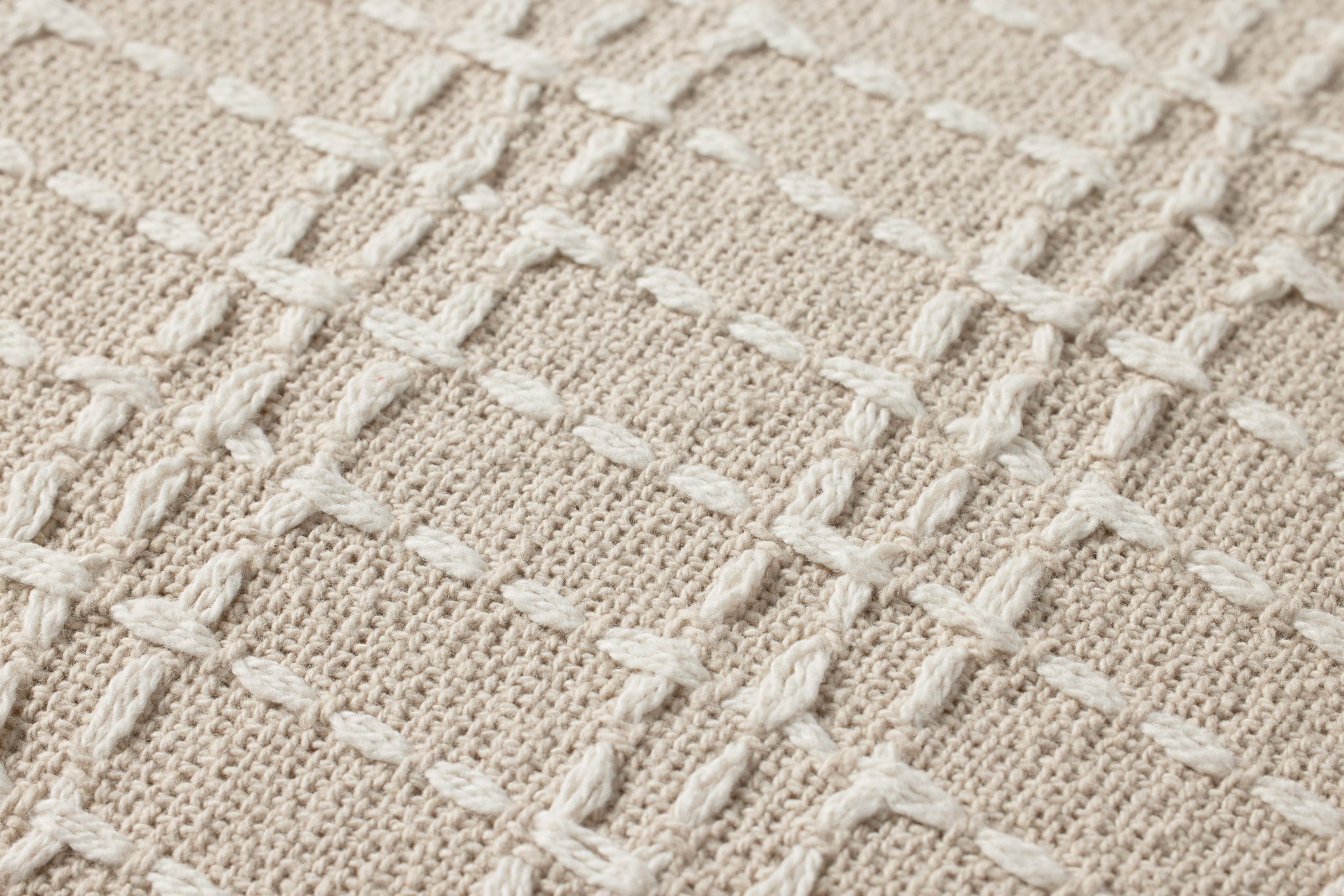 Beige / Ivory Pillow shown from a different angle to reveal its pattern.