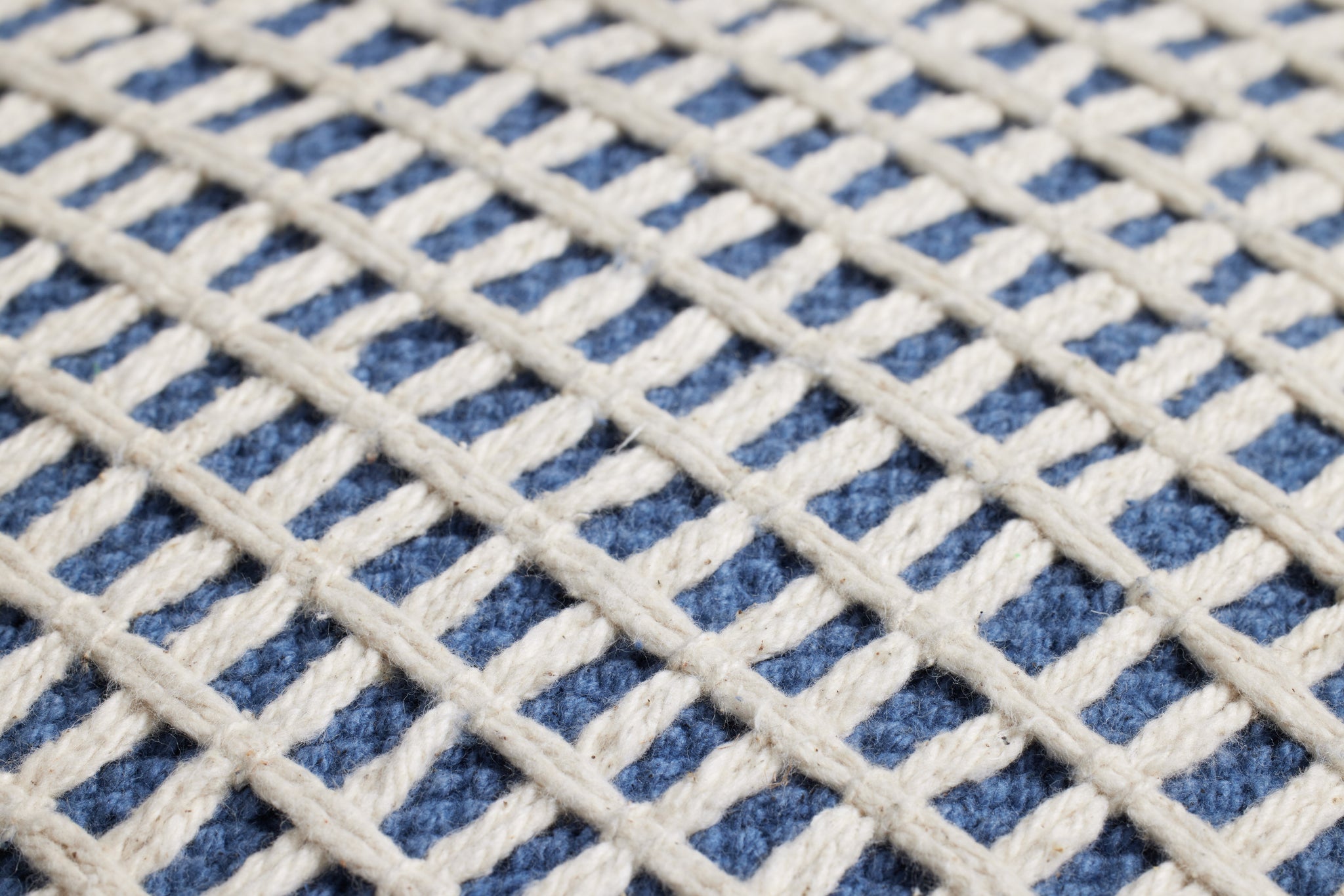 Blue / Ivory Pillow shown from a different angle to reveal its pattern.