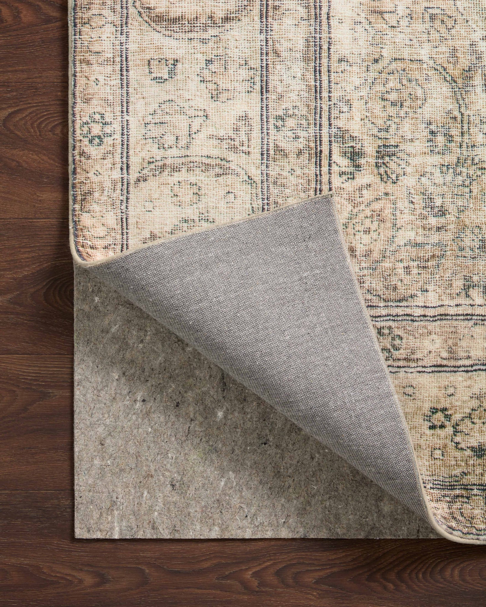 Grip 3/8" Beige Rug Pad shown from a different angle to reveal its pattern.