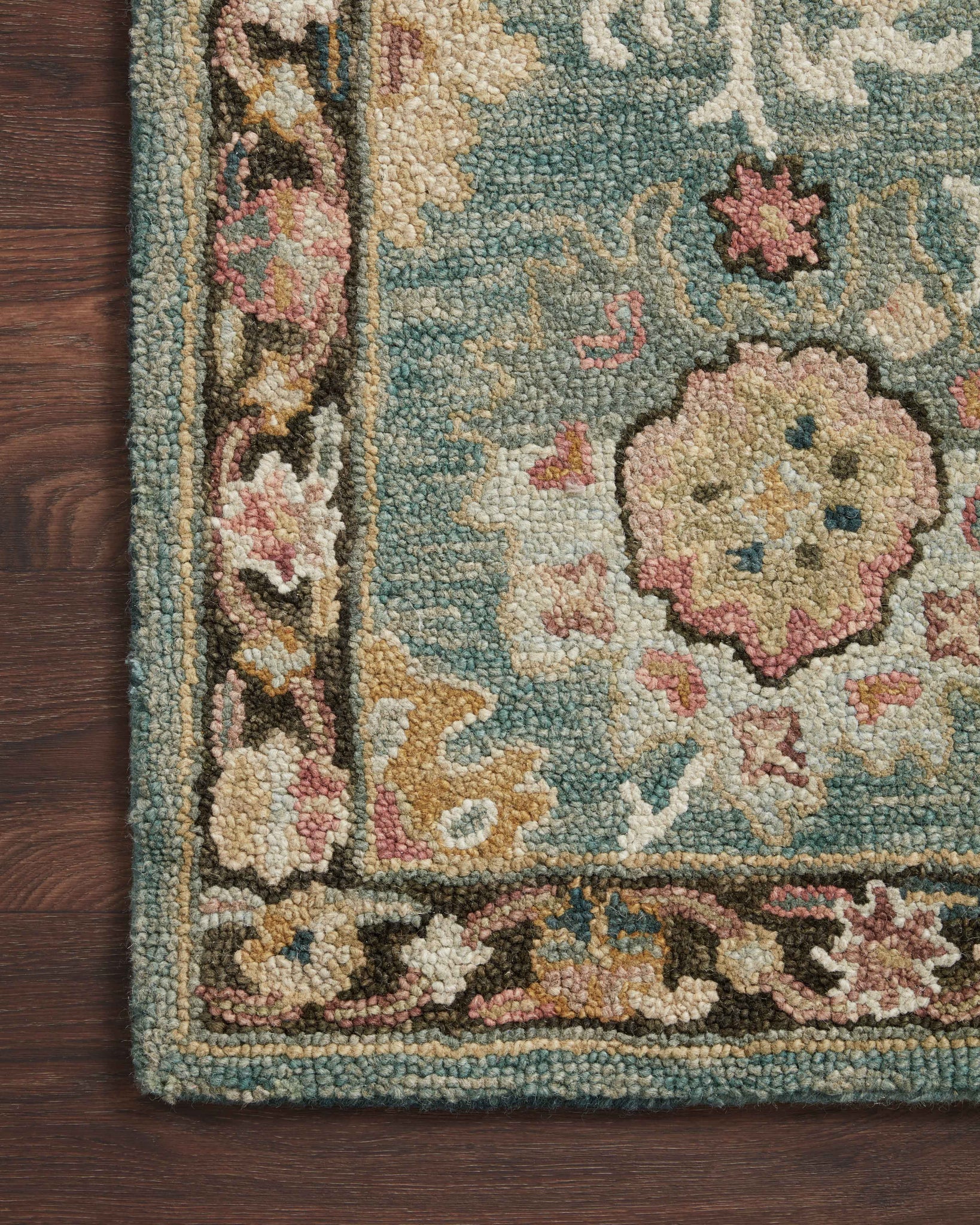 Side view of the Padma Teal / Multi rug.