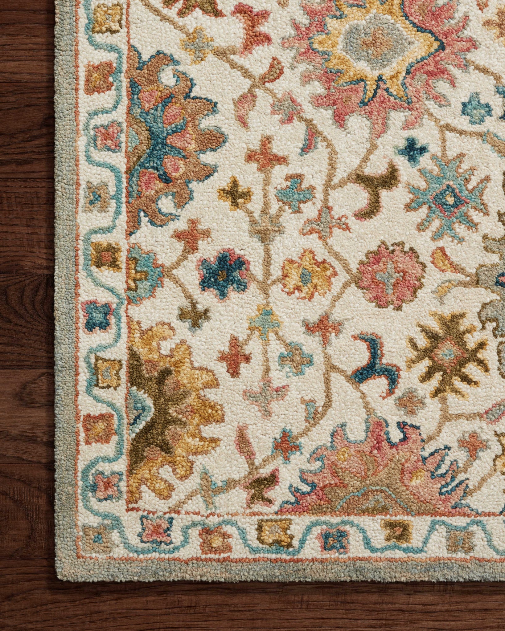 Side view of the Padma Ivory / Multi rug.