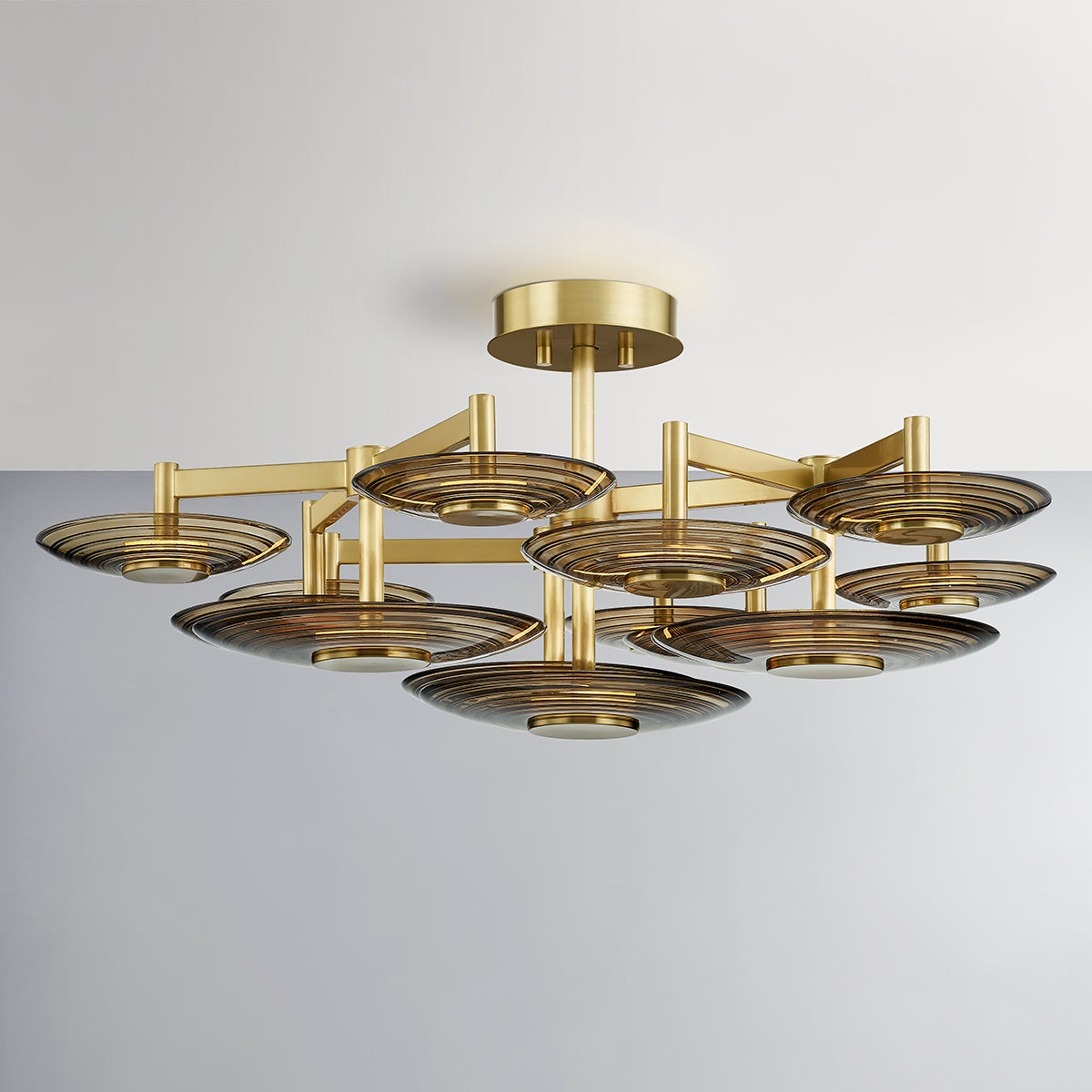 Griston Semi Flush 44" in aged brass shown from the front to reveal the shade profile and mounting canopy.