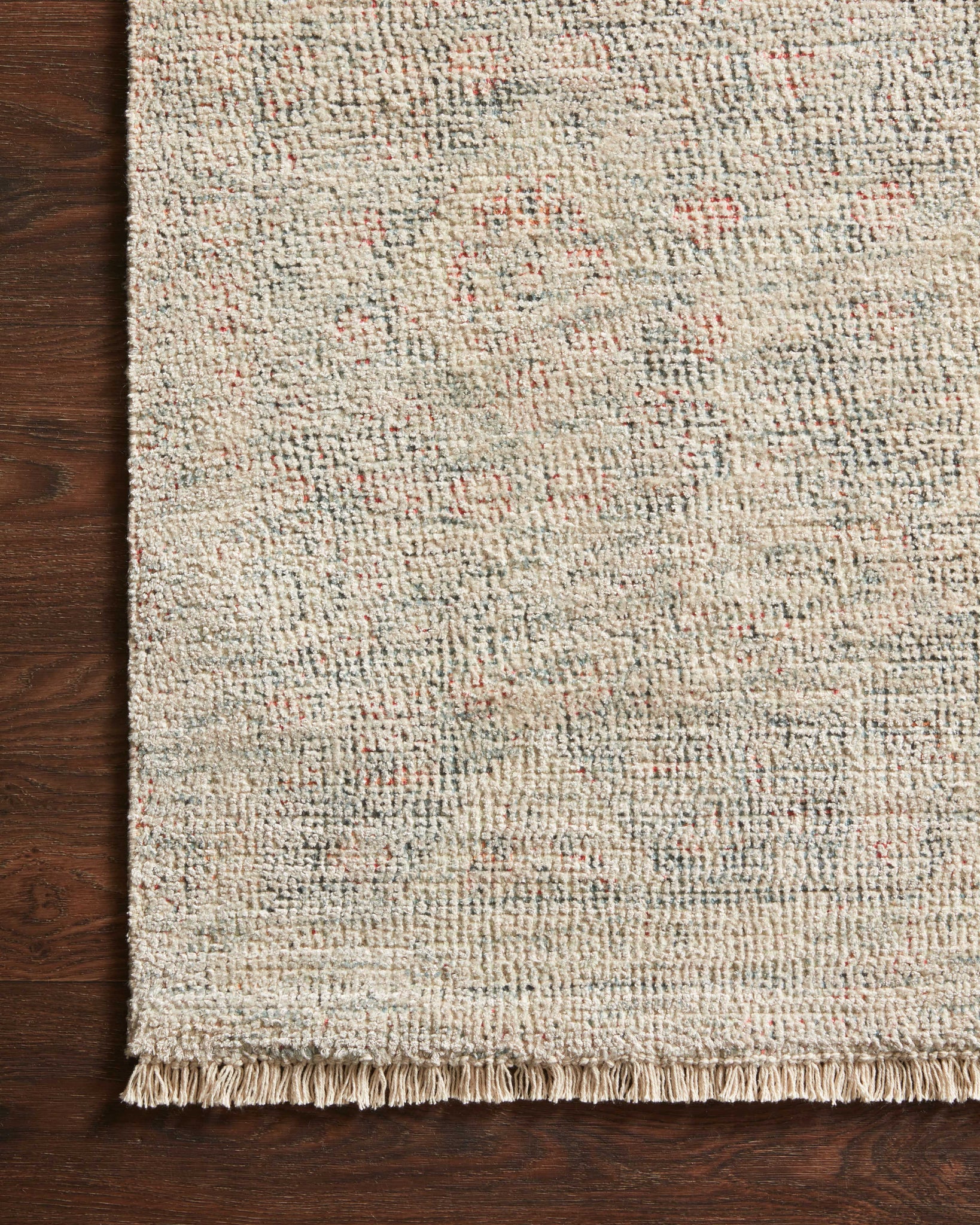 Side view of the Priya Navy / Ivory rug.