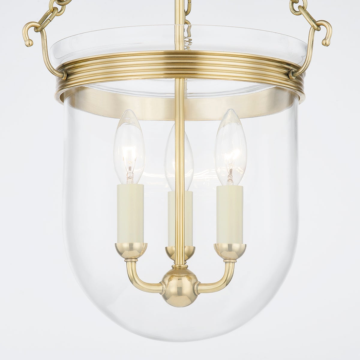 Rousham Lantern 12.75" in aged brass shown from the front to reveal the frame and glass panel detail.