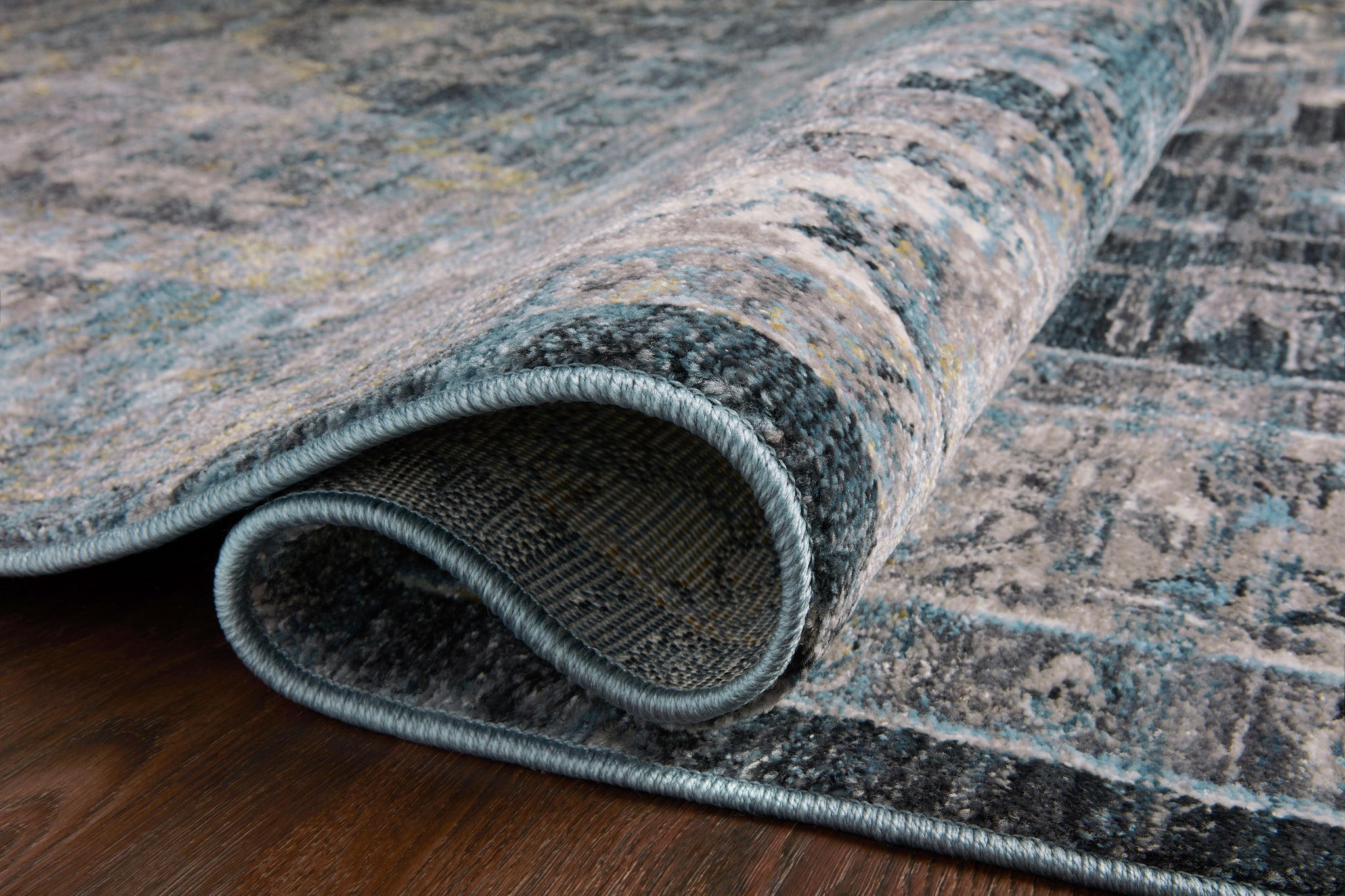 Samra Denim / Grey shown from a different angle to reveal its pattern.