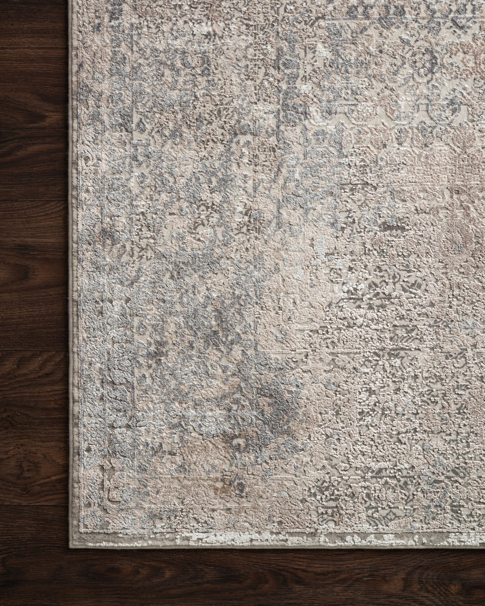 Sienne Ivory / Pebble styled underfoot in a layered living room at Laurie Yapp Home.