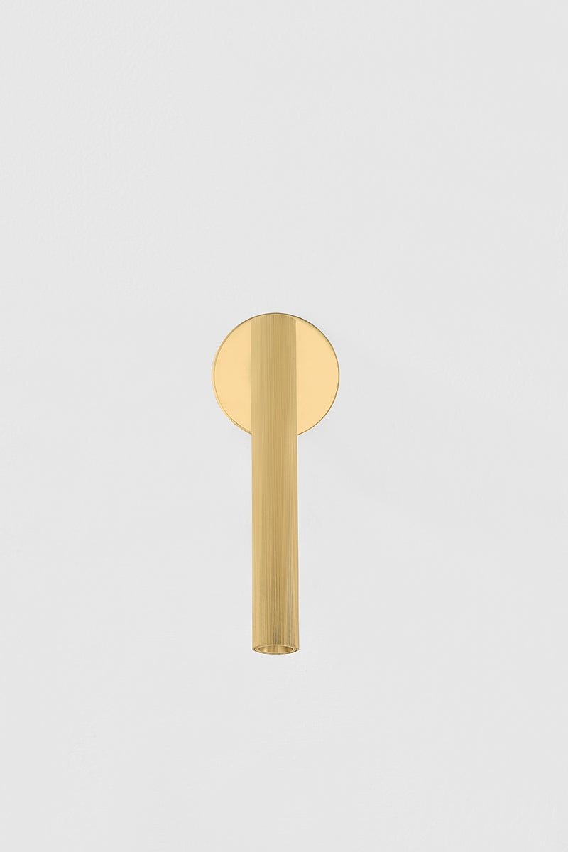 Simeon Wall Sconce in aged brass shown from a second angle to highlight the arm curve and shade silhouette.