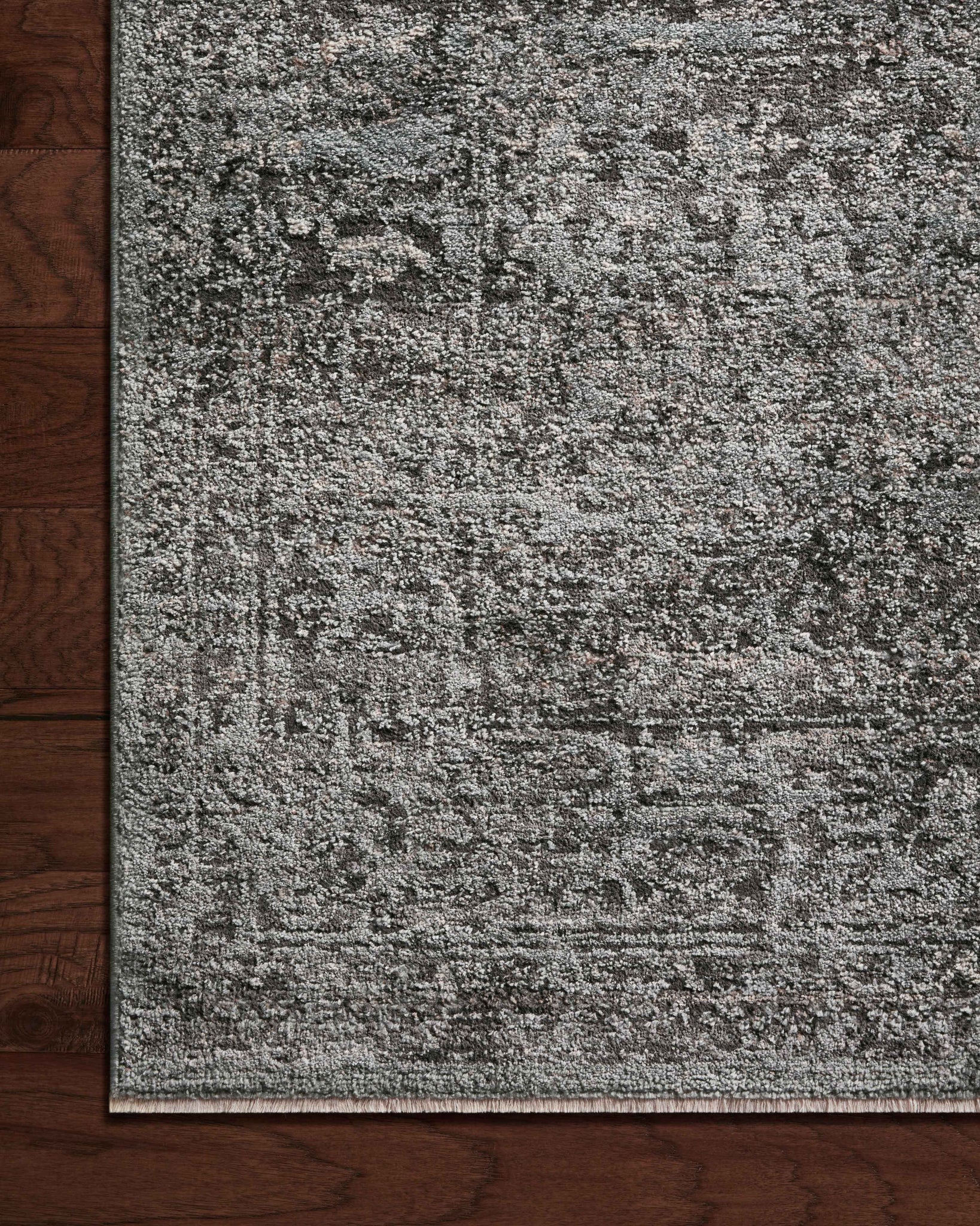 Side view of the Sonnet Charcoal / Mist rug.