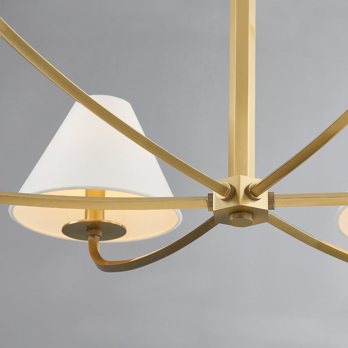 Close-up of the Stacey Chandelier 40.25" in aged brass showing the frame, arms, and shade detail.