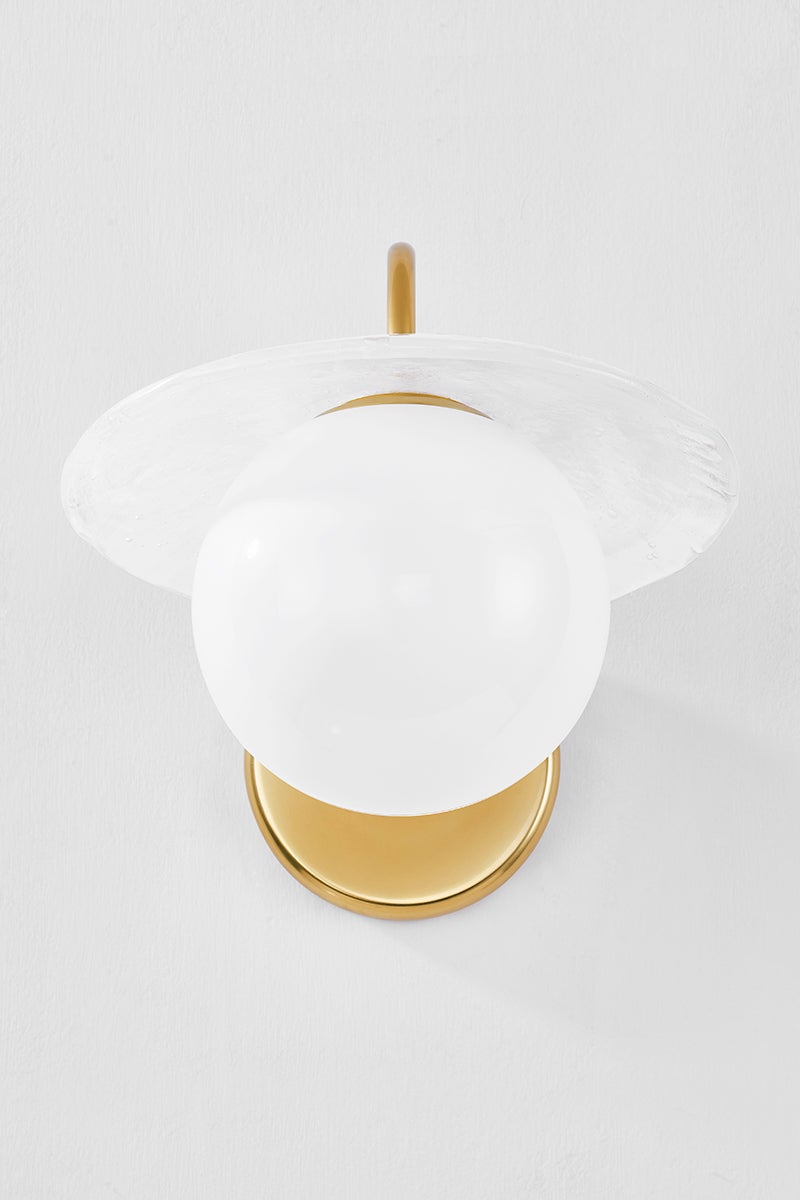 Stampford Wall Sconce in aged brass shown from a second angle to highlight the arm curve and shade silhouette.