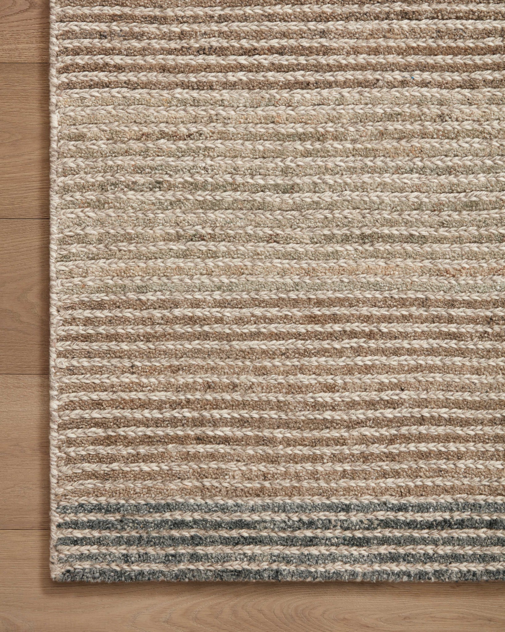 Side view of the Stiles Beige / Slate rug.