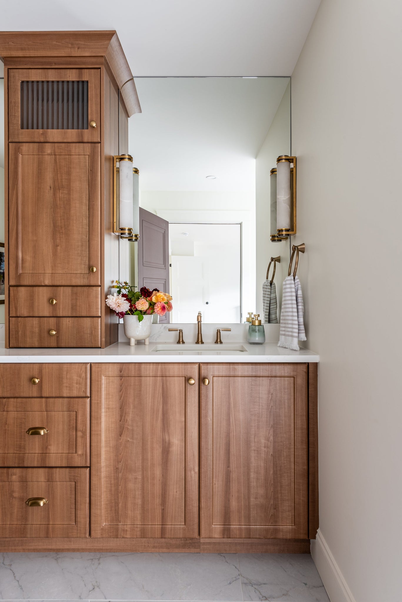 Sorrento Wall Sconce 3" x 17" styled in a warmly lit hallway for warm, layered light at Laurie Yapp Home.