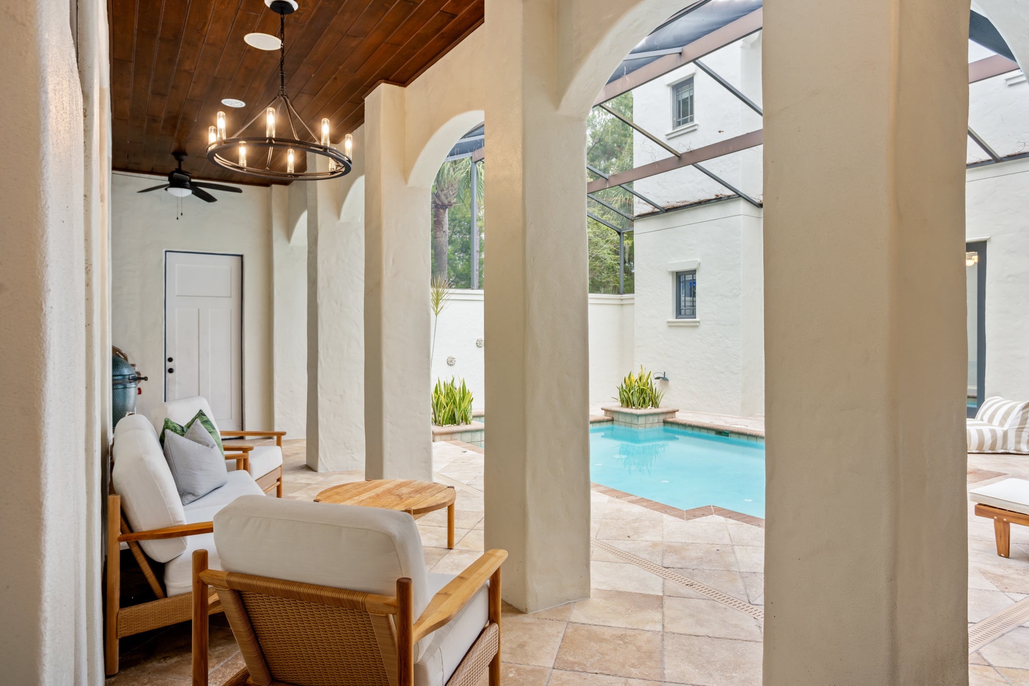 Sutton Exterior Chandelier styled in an elegant dining room for warm, layered light at Laurie Yapp Home.
