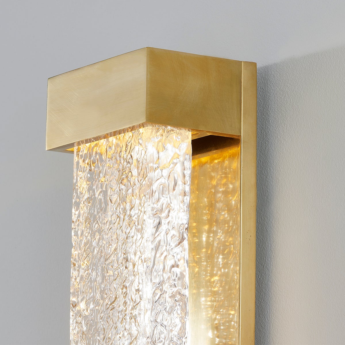 Wharton Wall Sconce 5" x 23" in aged brass shown from a second angle to highlight the arm curve and shade silhouette.