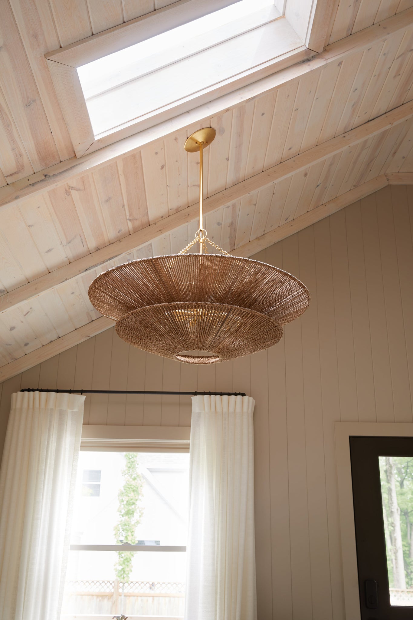 Tropea Chandelier styled in an elegant dining room for warm, layered light at Laurie Yapp Home.
