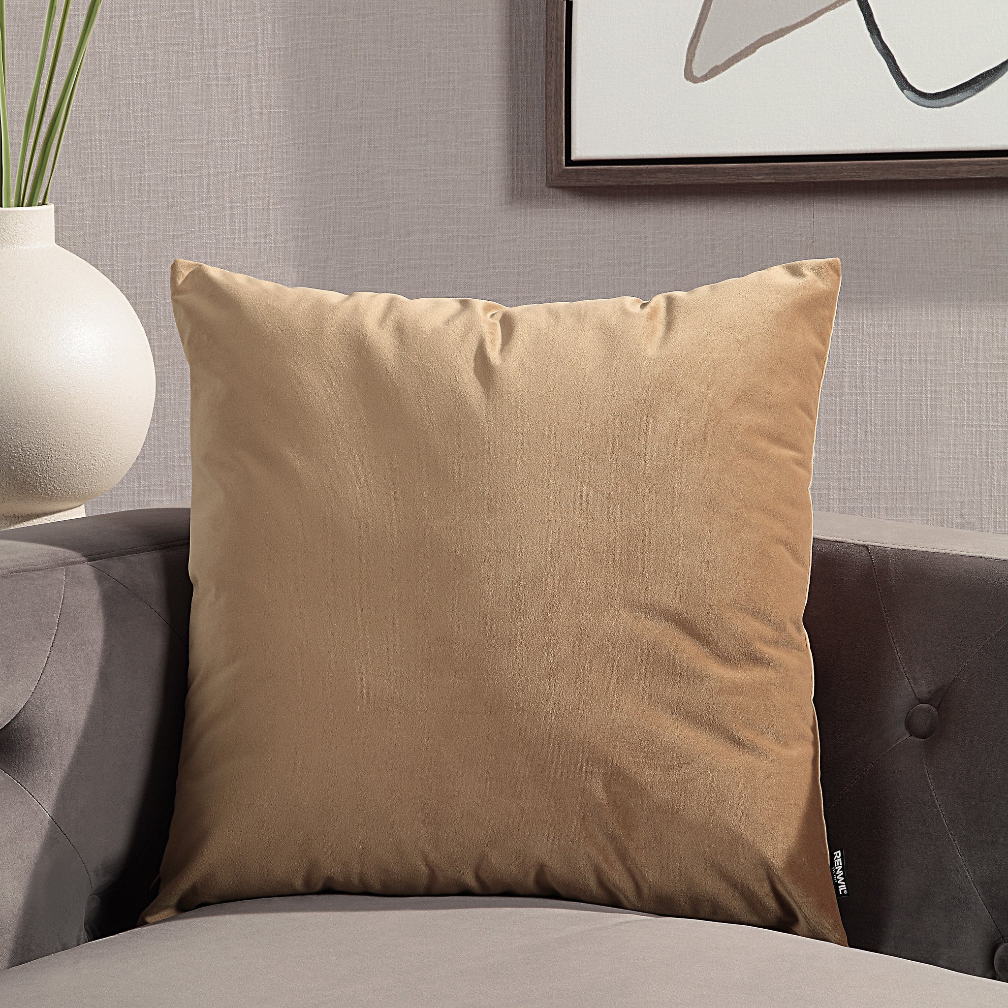 Alchemilla Indoor Pillow in brown velvet, styled on a gray sofa with modern decor.