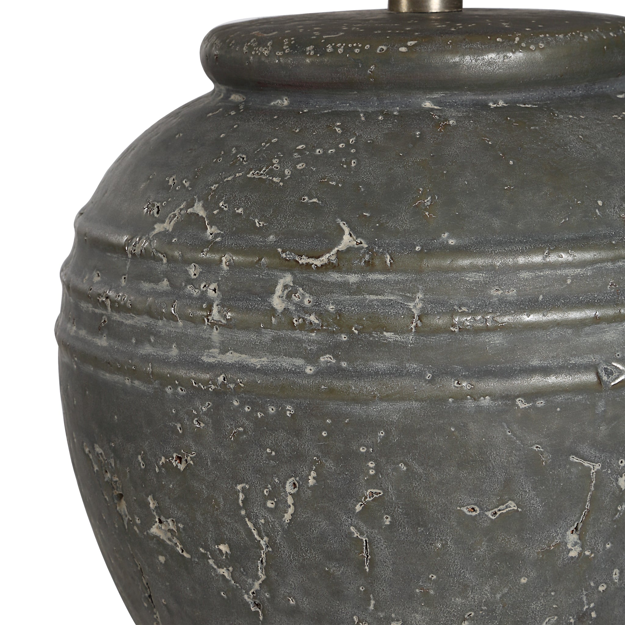 Close-up of Lino Table Lamp's gray ceramic base showing textured finish and decorative lines.