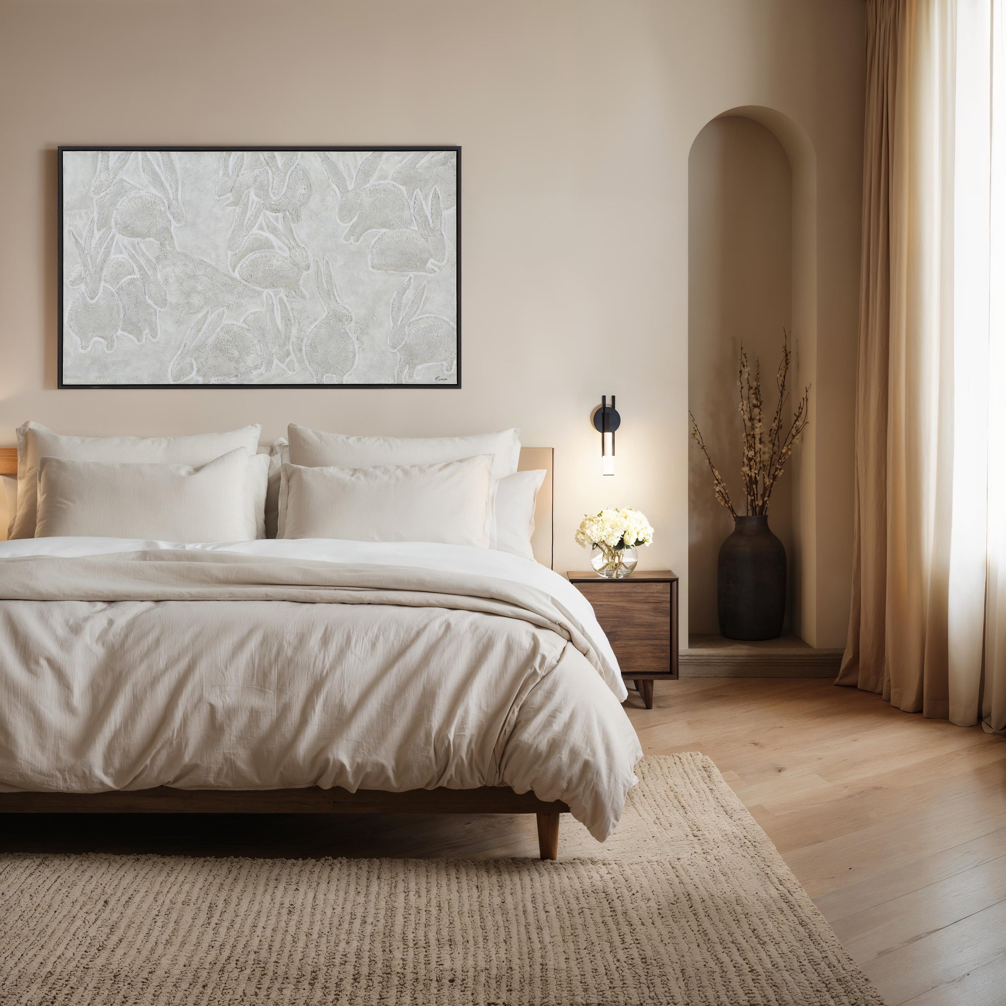 Lacey canvas art displayed above a bed in a neutral-toned bedroom, framed in black.