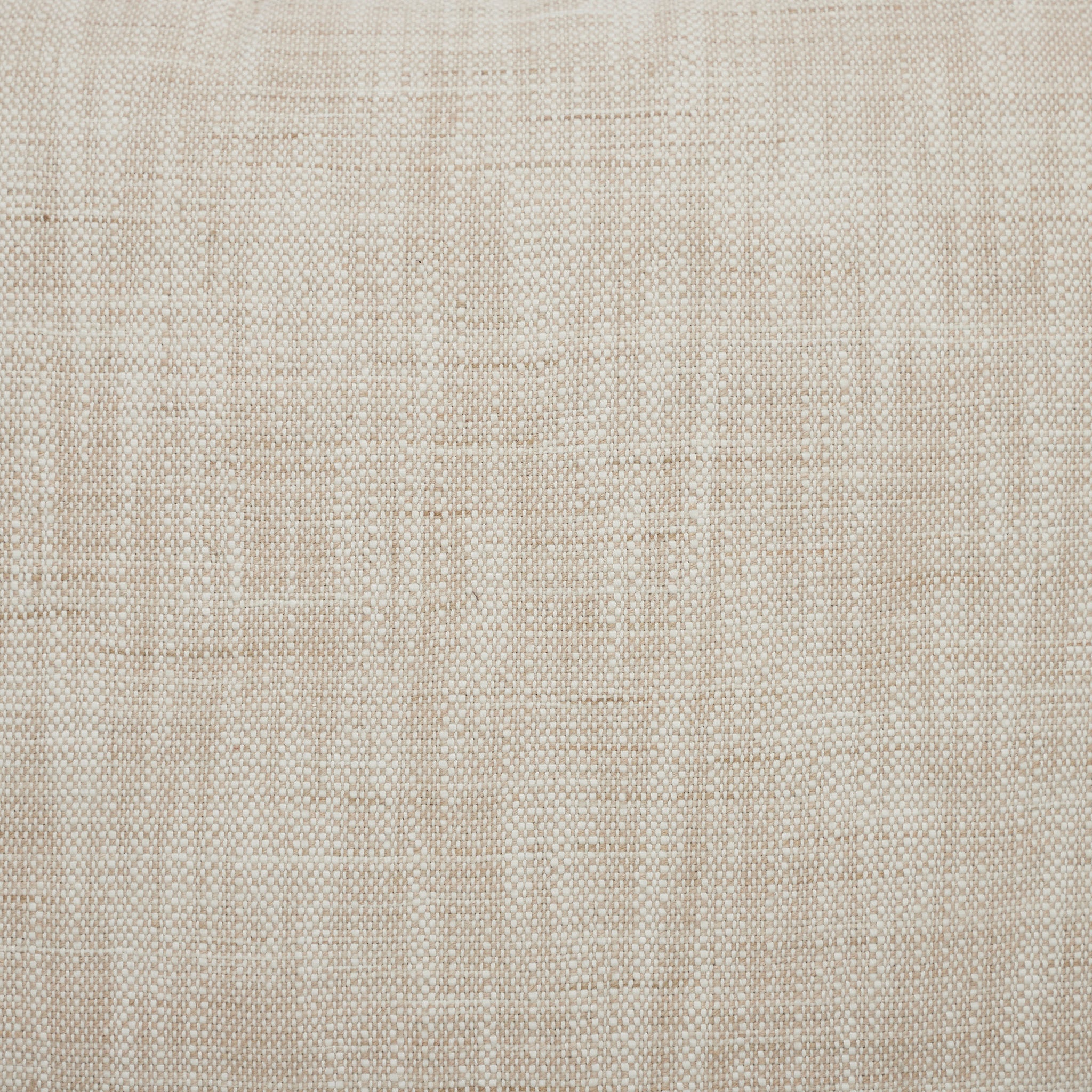 Close-up of Amal indoor pillow showcasing its light beige textured fabric.