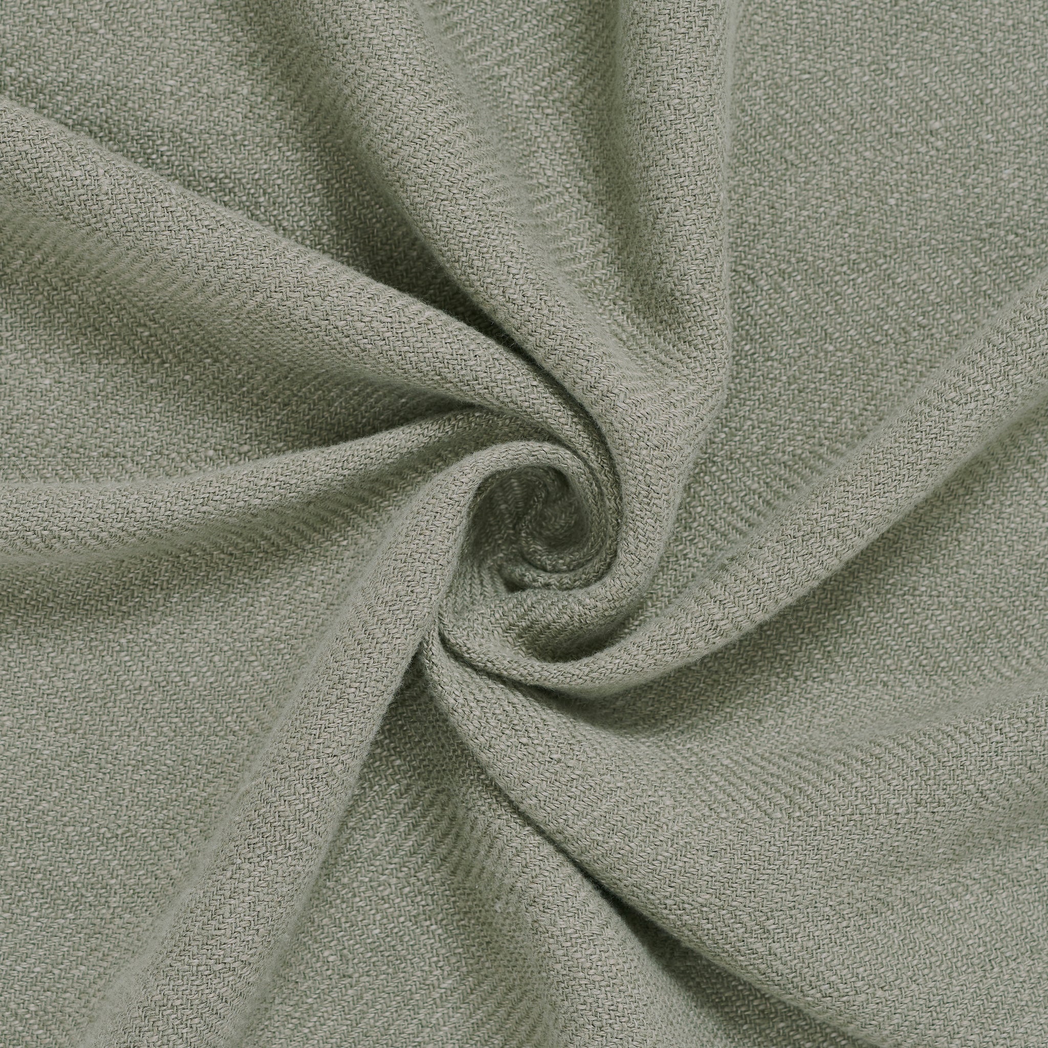 Pisces indoor pillow fabric in soft light green, displaying a smooth, woven texture.