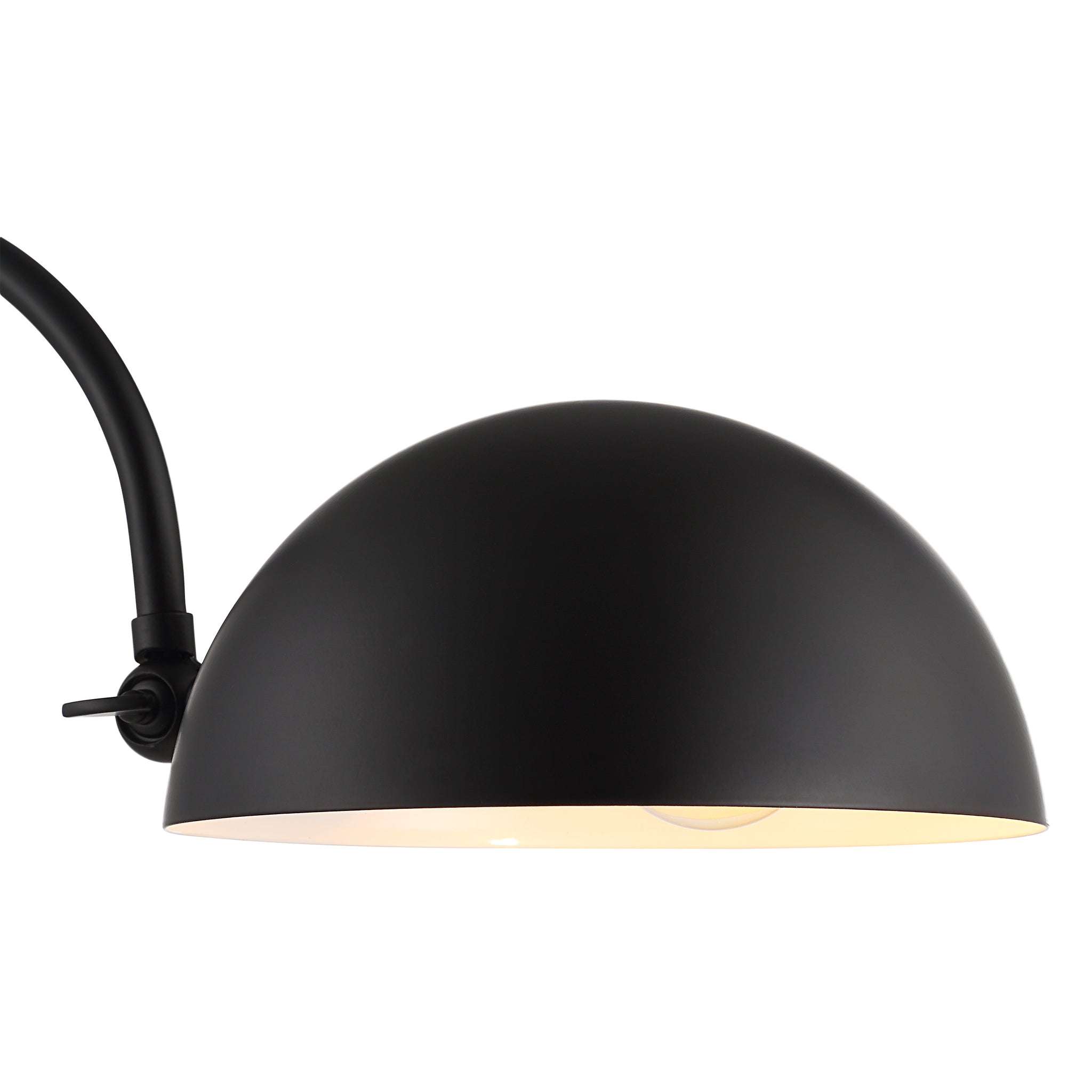Close-up of Sansia Table Lamp's black dome shade with a warm interior.