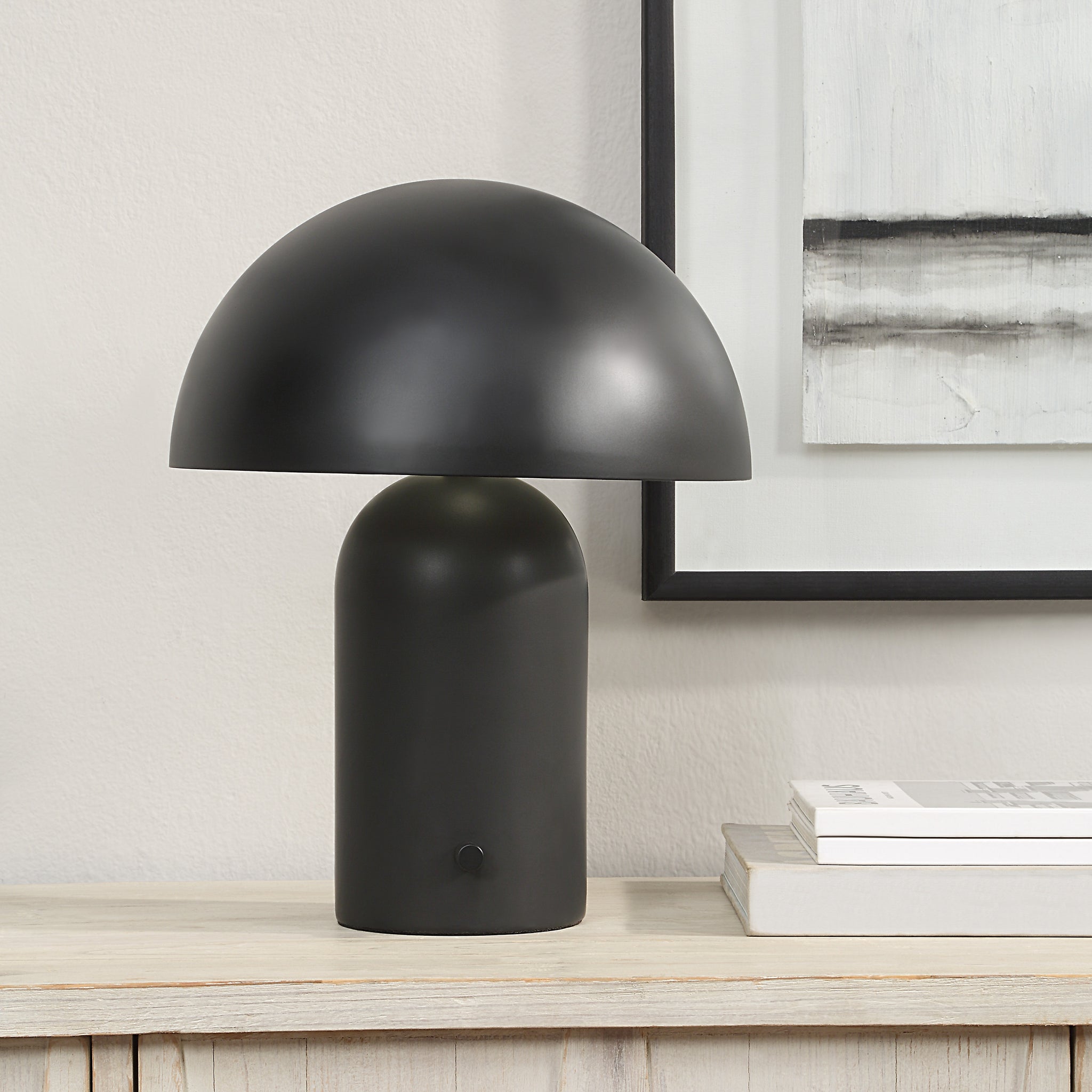 Sombra Table Lamp by Renwil, black lamp on a wooden table next to framed art