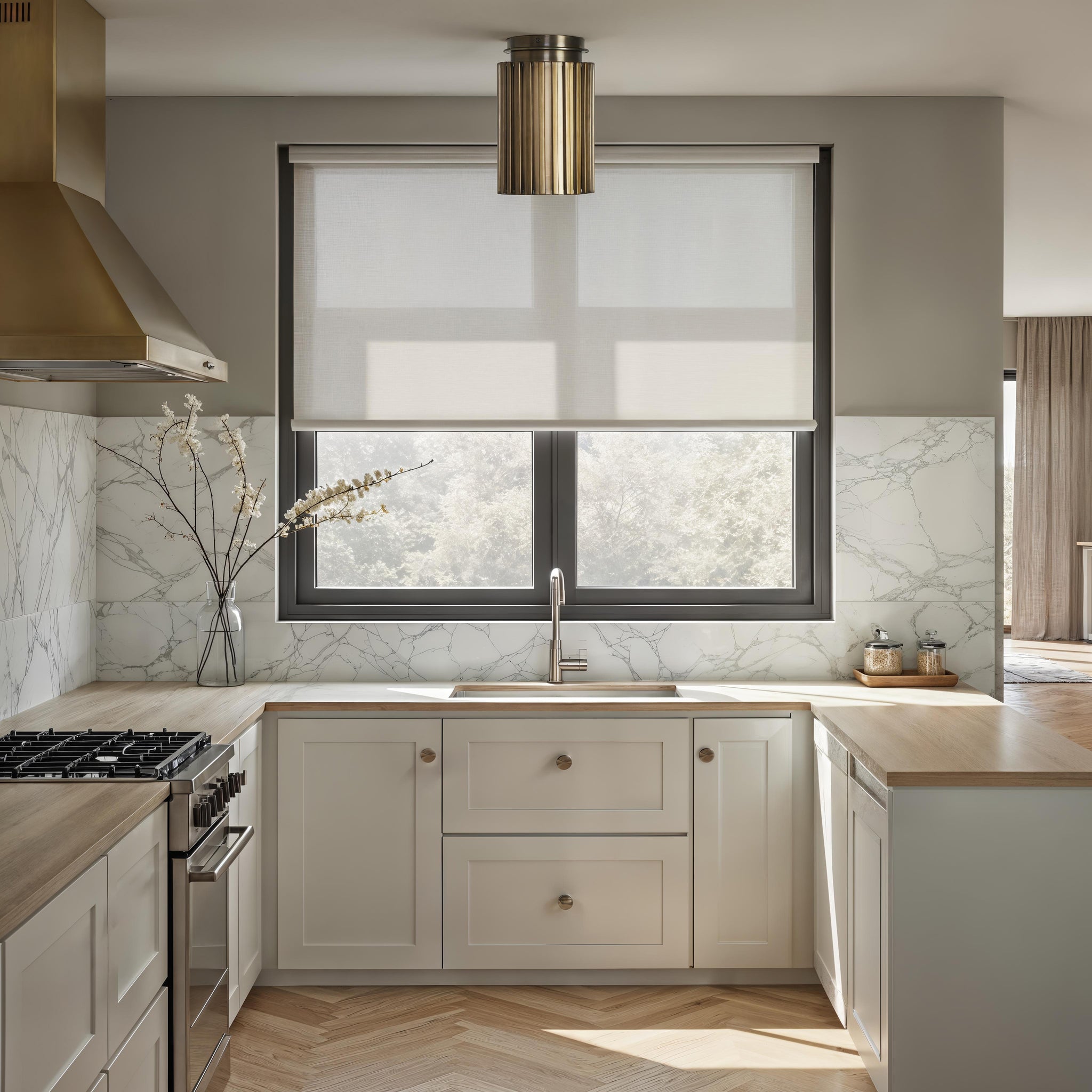 Fenice Flush Mount light above a kitchen sink, featuring a modern design with marble backsplash.