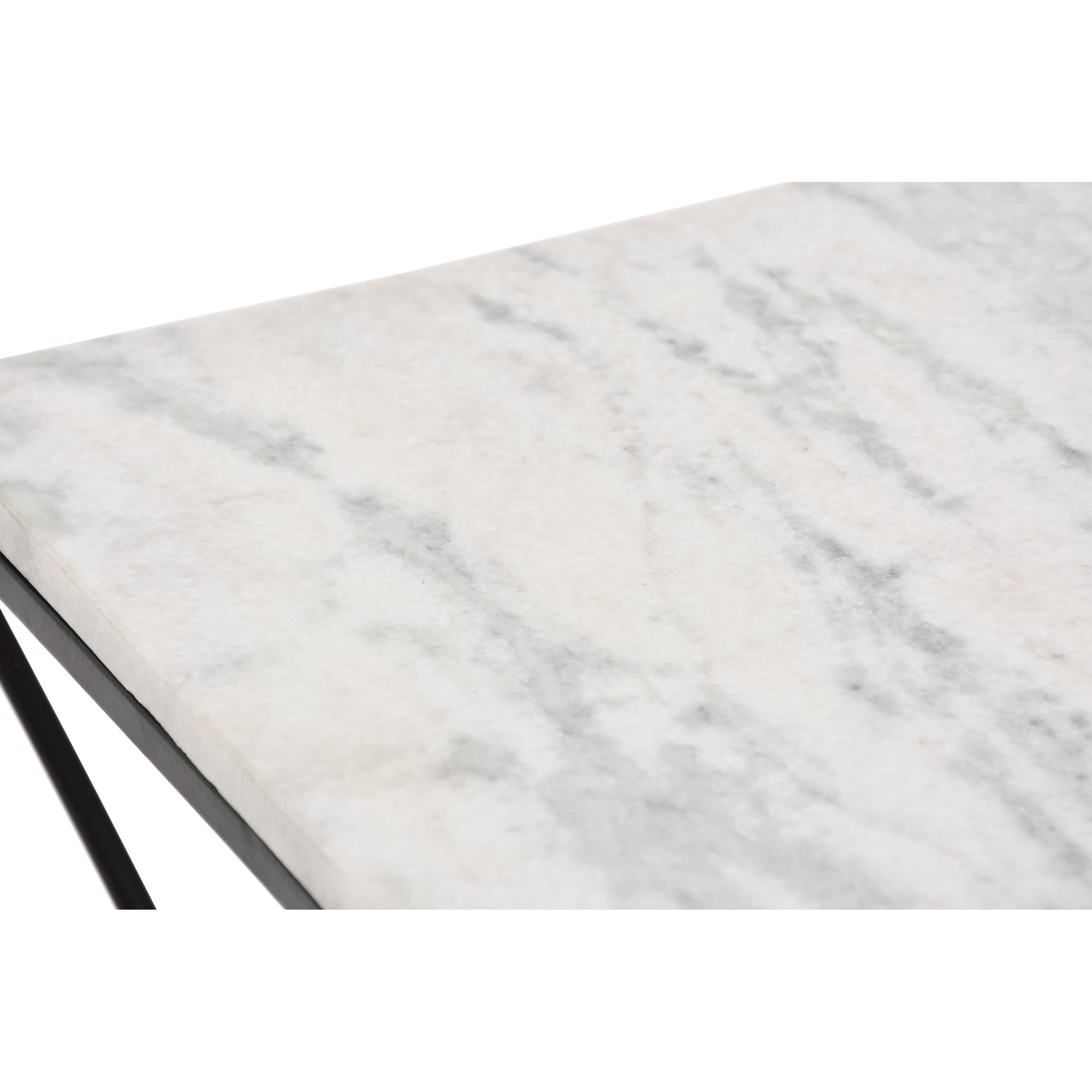 Close-up of SYMMETRY table's white marble top with gray veining