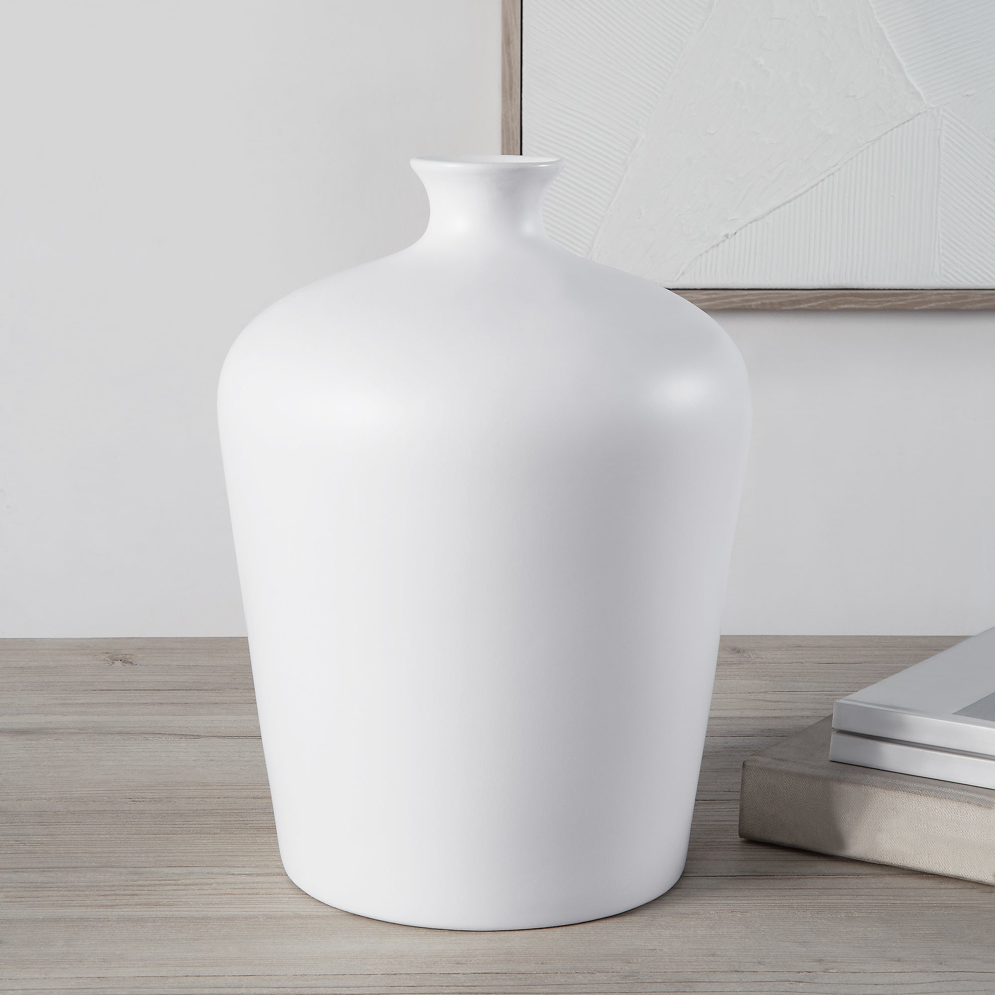 Alfano Vase by Renwil, white ceramic vase displayed on a wooden surface with decor