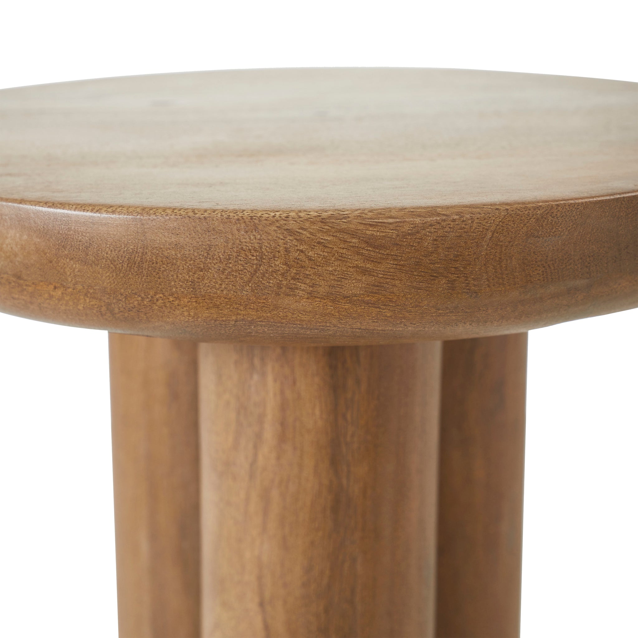 Close-up of Honey Side Table's round wooden top with smooth surface and natural wood grain