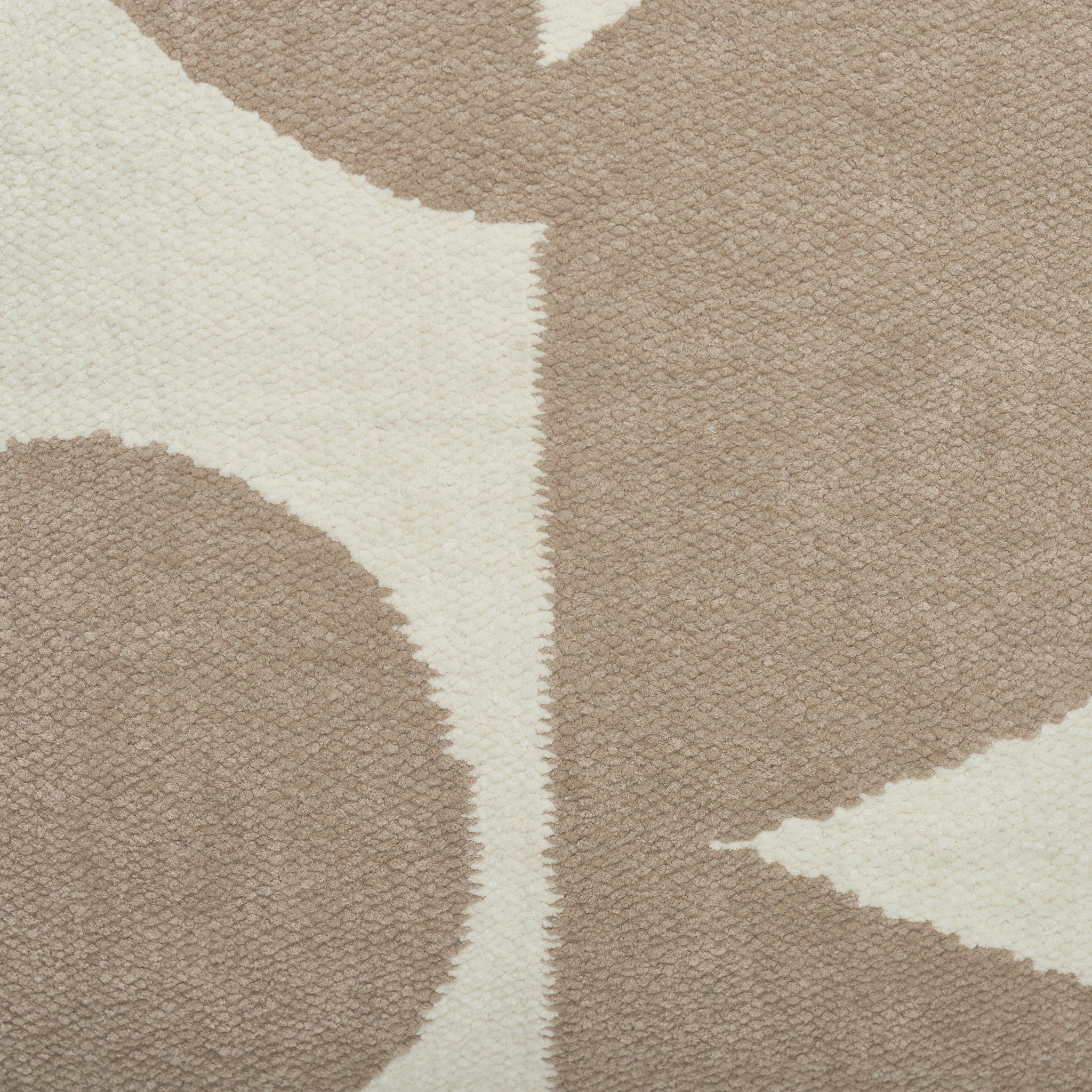 Close-up of Ferla Indoor Pillow showing textured beige and cream pattern