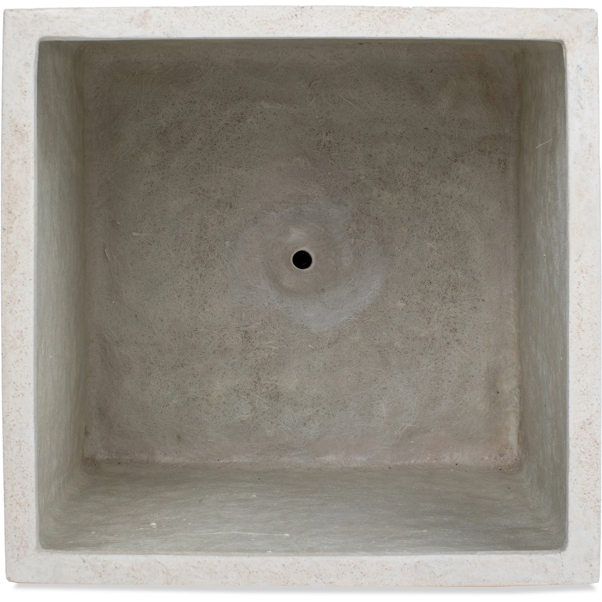 Top view of Alona Planter showing the interior in light concrete with a drainage hole.