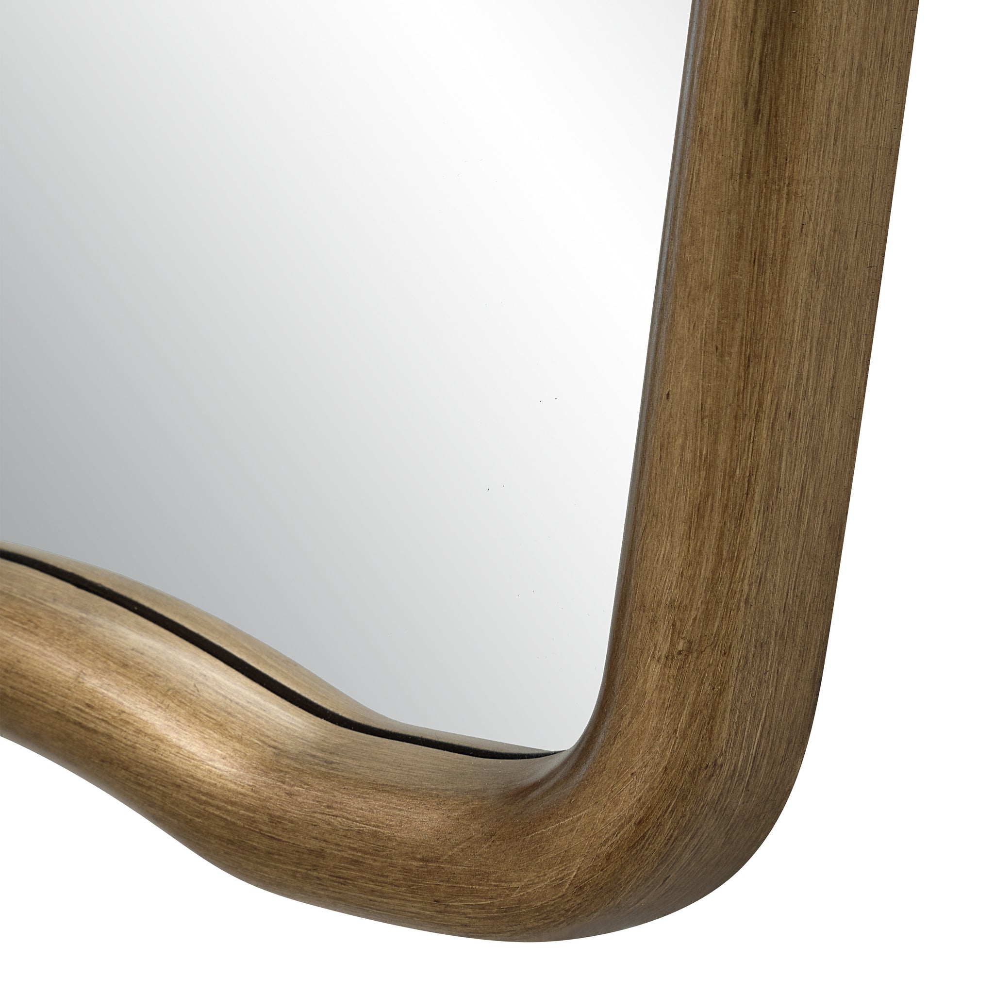 Close-up of Echoa mirror's gold frame with a smooth finish and reflective surface.