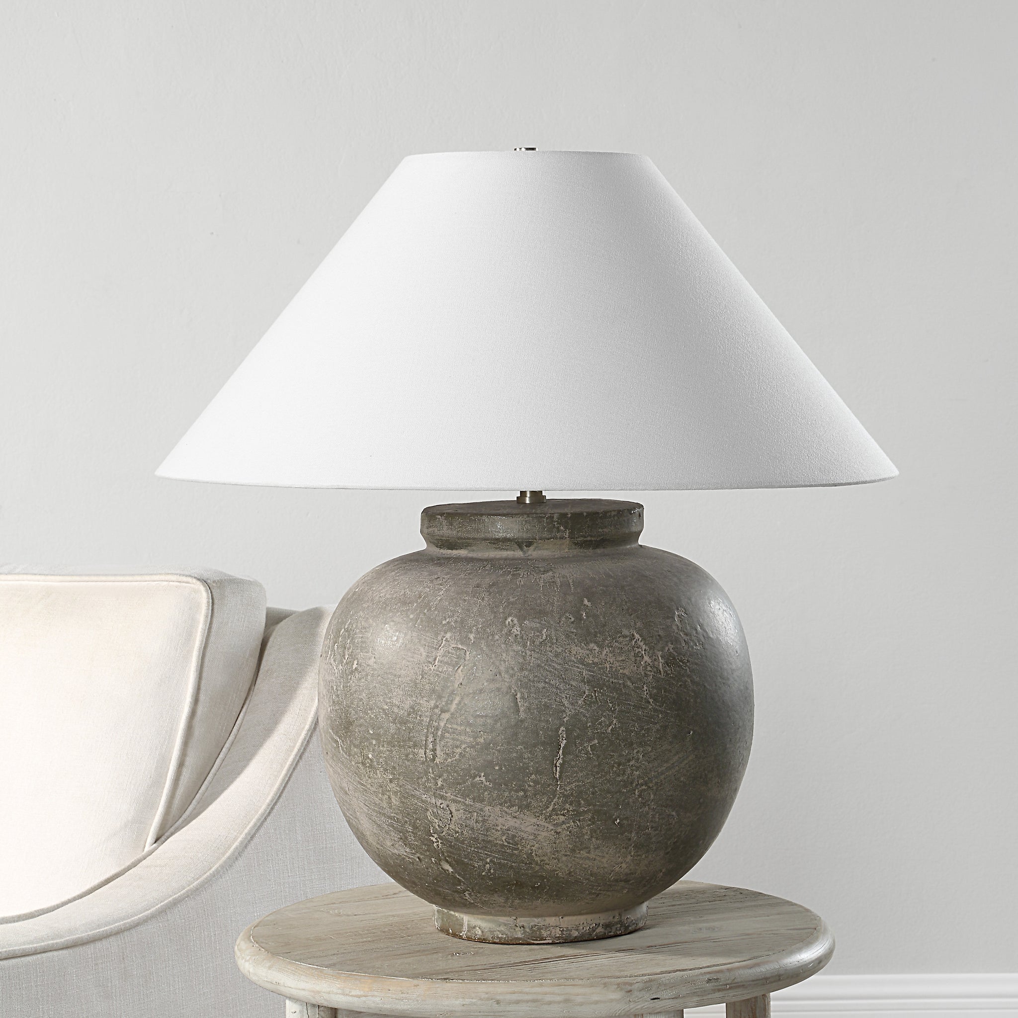 Olivia Table Lamp on a side table next to a light-colored sofa