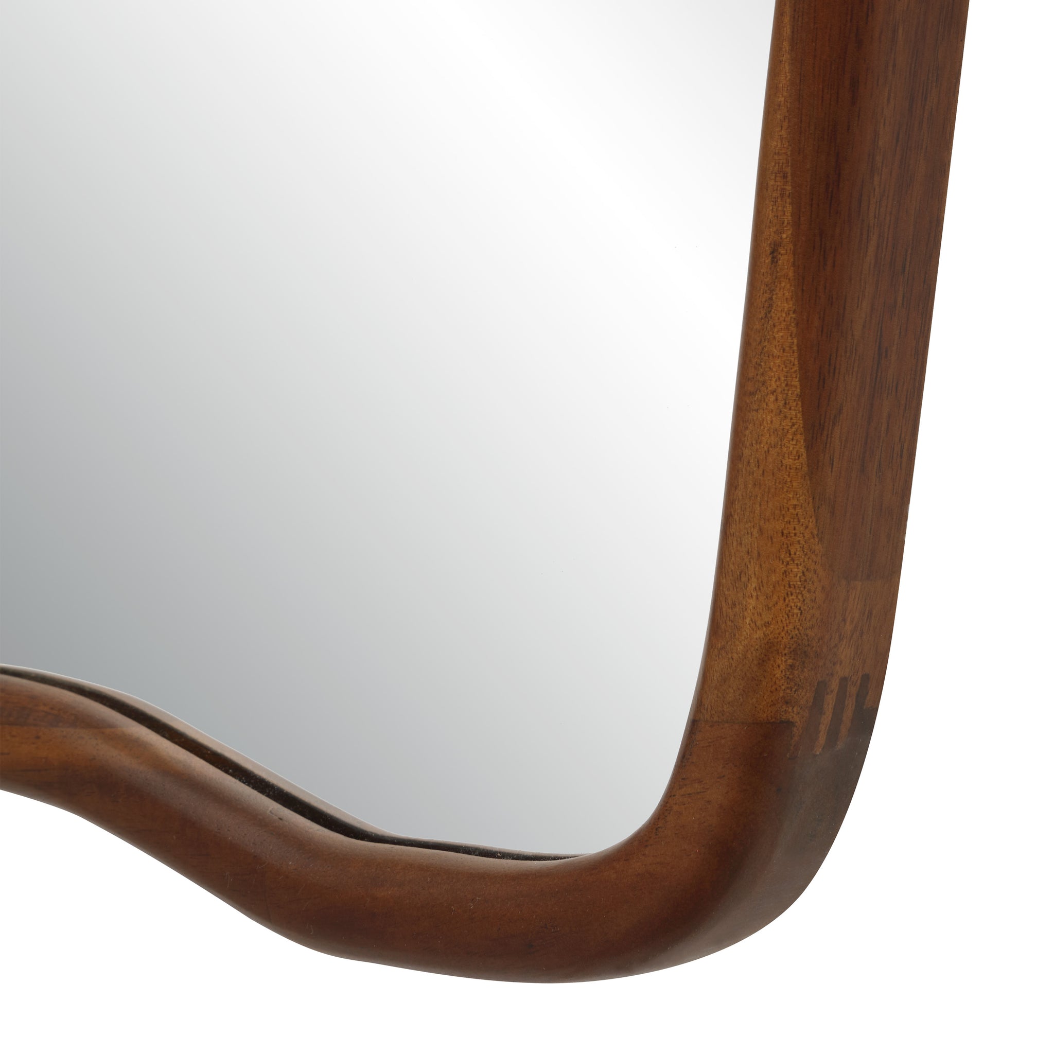 Close-up of Reverie mirror's wooden frame highlighting its smooth curves