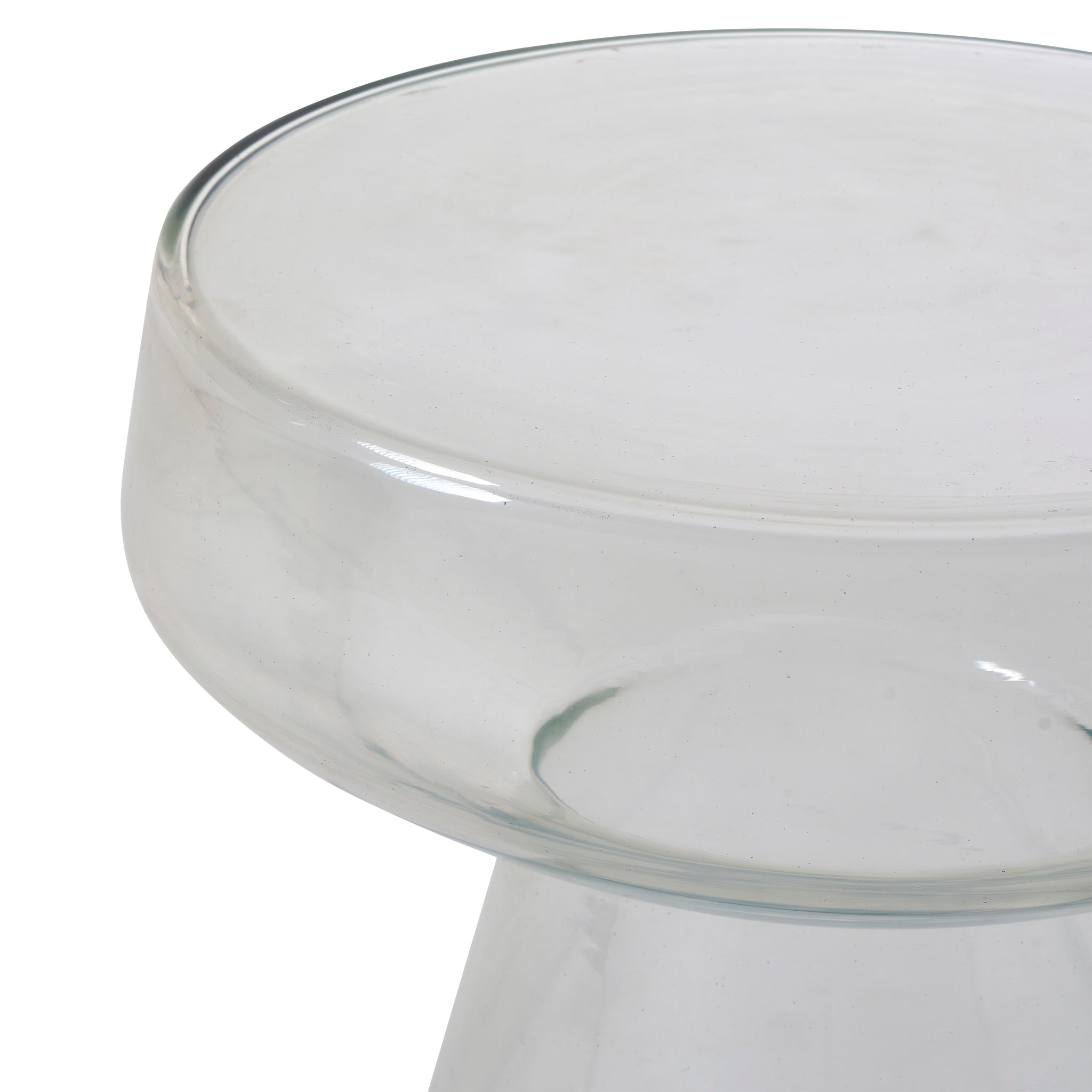 Lavanda table featuring a clear glass surface and conical base, close-up view.