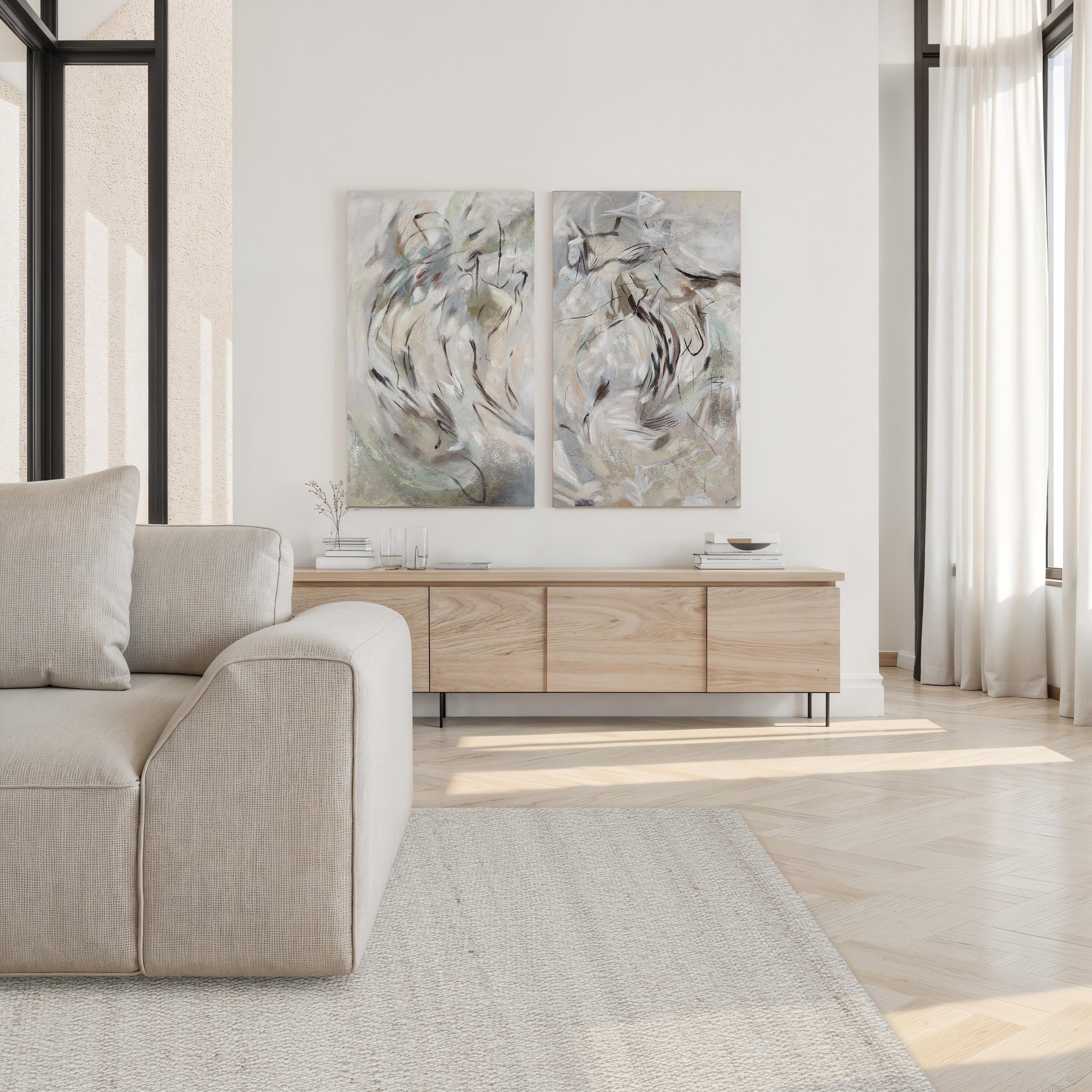 Meghan rug in soft beige, positioned under a light-colored sofa in a modern living room with artwork.