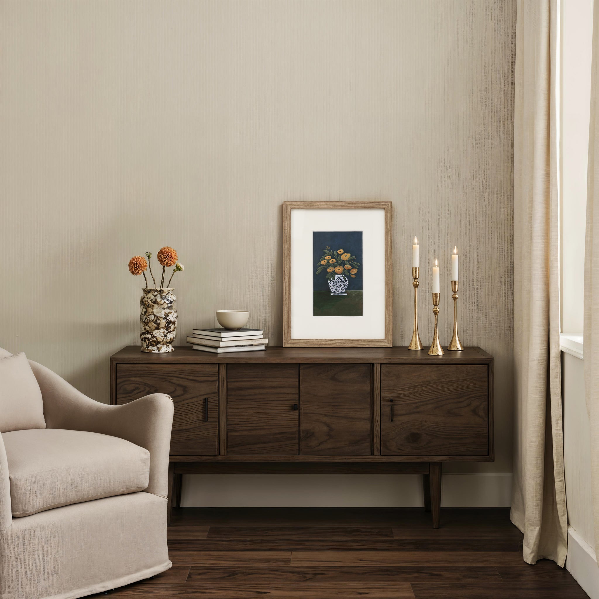Henriette decor featuring a wooden console table with a vase and framed artwork.