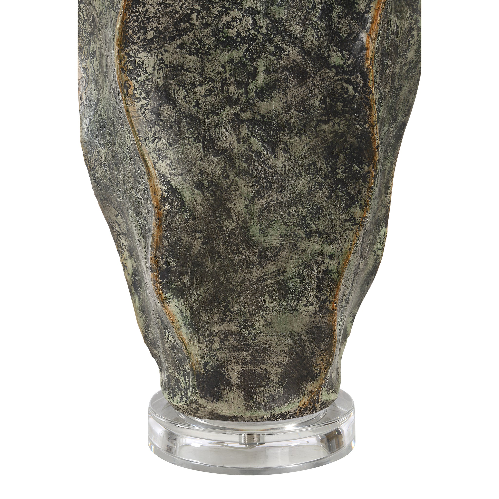 Close-up of Poppi table lamp's textured green ceramic base with a clear acrylic stand