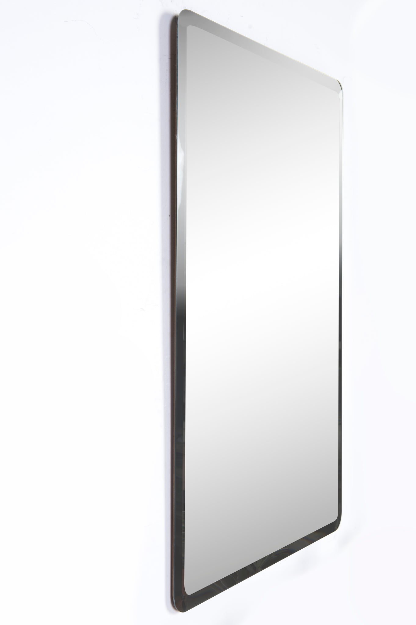 Danske Wall Mirror featuring a modern design with a silver frame, angled side view.